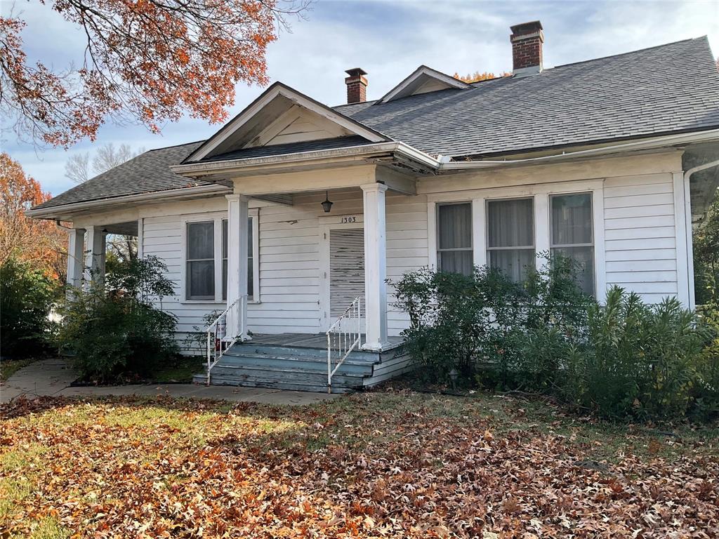Timeless charm and this beautiful old soul are just waiting for your loving ideas!  Nestled in the heart of Corsicana's Carriage District, this vintage home has untold history and amazing original wood floors! You will be astounded by the beauty of knotty pine paneling! The home has, as they say, good bones and a tremendous potential for beautifully transforming this gem into your dream home! The rooms are generous, and unusual for this era, many ample closets!  Adding additional square footage there is a second story attic area ready for buildout! The detached garage with storage area has a fenced area for pets. A water well on the property adds untold value and can ease the burden of watering the yard this summer!
Time to own a piece of Corsicana's rich history while enjoying convenience of nearby amenities and a quiet sought after neighborhood!