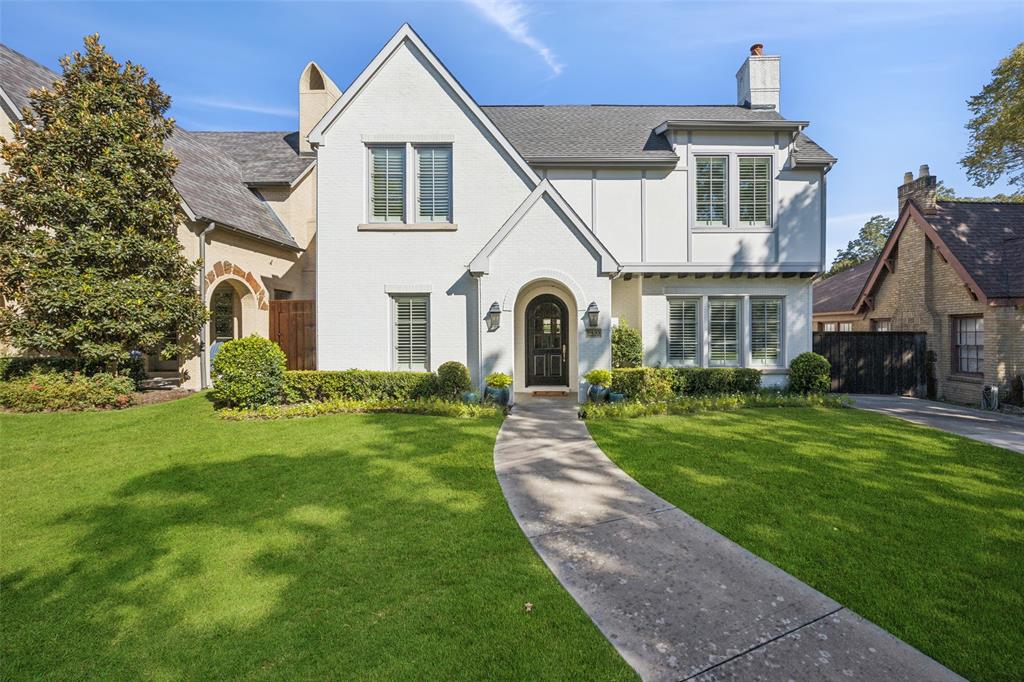 Tucked away on a quiet street in Lakewood, this stunning modern Tudor combines timeless architecture with fresh, contemporary design. Built in 2014, the home offers over 4,300 square feet of thoughtfully designed living space with 4 bedrooms, 4.5 baths, and elegant finishes throughout. A welcoming foyer opens to a private study and formal sitting area, leading to a light-filled open floor plan ideal for entertaining. The chef’s kitchen features a large island, quartz countertops, custom cabinetry, stainless appliances, and walk-in pantry. The adjoining living room is anchored by a fireplace, custom built-ins and surrounded by oversized windows that overlook the backyard. Upstairs, the primary suite offers a luxurious retreat with spa-like bath, dual vanities, soaking tub, and generous walk-in closet. Each secondary bedroom has its own en-suite bath for ultimate privacy and convenience. Outdoor living is easy with a covered patio and built in grilled area, perfect for relaxing or entertaining. Additional highlights include wood floors, designer lighting, a wet bar with wine room, and a detached two-car garage. Located in highly sought-after Lakewood Elementary, this home offers proximity to White Rock Lake, Lakewood Country Club, and all the shopping and dining along Abrams and Mockingbird. A rare blend of sophistication, function, and location—this home truly embodies the best of East Dallas living.