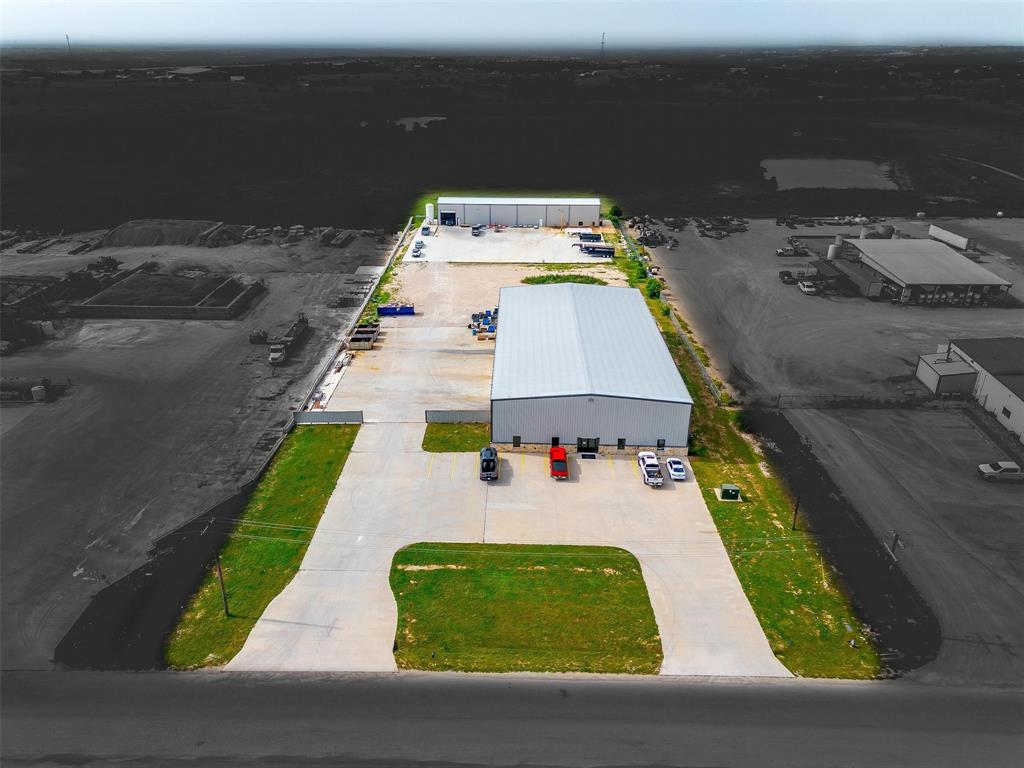 This versatile 16,500 SF industrial property is located in Cresson with quick access to Granbury, Weatherford, and Fort Worth, features two well-equipped buildings ideal for a range of business operations. The front building offers 12,000 SF, including 2,000 SF of office space (17%) and 10,000 SF of warehouse with 24' clear heights, clear span construction, and three 15'x15' roll-up grade doors and 3-phase power. The back building consists of 4,500 SF of warehouse space with a 24' clear height, one 15'x15' roll-up door, a restroom, and an existing craneway spanning half the structure. With excellent accessibility and flexible space configurations, this property is well-suited for manufacturing and office warehouse use.