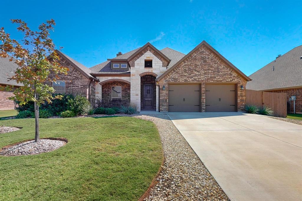 Welcome to Meadow Place Estates! No HOA! Located within highly sought-after Aledo ISD! This beautiful 4-bedroom, 2-bath home offers an open-concept floor plan designed for comfortable living and entertaining. At the heart of the home, the spacious living area is highlighted by a charming stone wood-burning fireplace, adding warmth and character to the space. Hardwood floors flow throughout the main living areas, while the kitchen features off white cabinetry, granite countertops, stainless steel appliance and a large walk-in pantry. Designed with comfort in mind, the spacious primary suite offers a spa-inspired en-suite bathroom with dual vanities, a relaxing garden tub, a separate shower, and an oversized walk-in closet complete with build-in shelving and a full length mirror. The secondary bedrooms are generously sized, providing plenty of space for family, guest, or a home office. Enjoy being within walking distance to parks, dining, and entertainment at The District at Willow Park. Don't miss your opportunity to own this exceptional home in a prime location. Schedule your showing today!