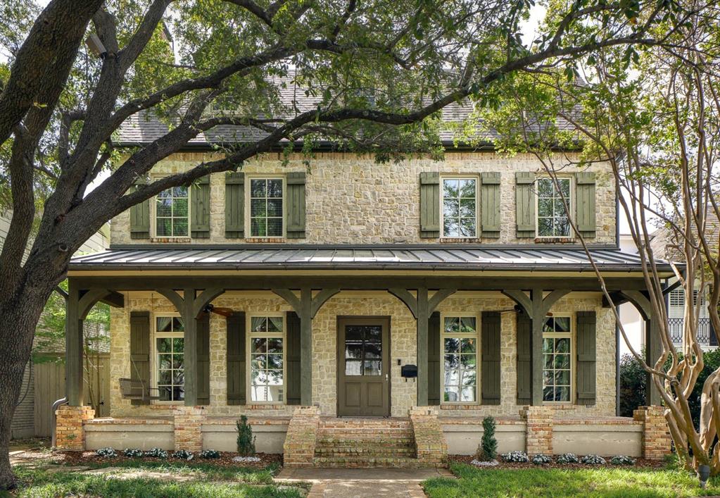 Fall in love at first sight with the inviting front porch, then discover a home where exceptional craftsmanship meets an unbeatable Highland Park location, moments from HP Middle School, SMU, Snider Plaza, and Highland Park's most beloved destinations, including DCC, HP Village, the Katy Trail and numerous restaurants and shops. Custom-built with all stone and brick, and special features, you enter into a wide, welcoming foyer open to gracious formal living and dining rooms, each anchored by a wood-burning fireplace. Beyond, a sweeping staircase leads to an expansive great room that flows seamlessly into the breakfast area and gourmet kitchen, with open spaces ideal for both everyday living and entertaining. The second level features four spacious ensuite bedrooms, including a serene primary suite with windows on two sides, filling the space with natural light. The luxurious primary bath with Carrera marble offers dual vanities, separate tub and shower, and two walk-in closets. The utility room includes a hidden office with built-in desks. The secondary bedrooms feature walk-in closets and hardwood flooring. The third floor adds flexibility with a large game room and a fifth ensuite bedroom with private bath and walk in closets. Outdoors, mature trees create a shaded backyard retreat, complemented by front and rear patios perfect for enjoying the neighborhood setting. A detached three-car garage accommodates larger vehicles and is topped by beautifully appointed guest quarters with a full bath, walk-in closet, and central HVAC, perfect for visitors or extended stays from family or household staff. With 5,694 square feet in the main residence plus an additional 761 square feet in the guest quarters, this exceptional property offers space for everyone. The walkability is a plus, as is access to the Highland Park amenities like parks, HP Pool and HP Library, in addition to police & acclaimed HP schools. A true classic in one of the city’s most sought-after locations.