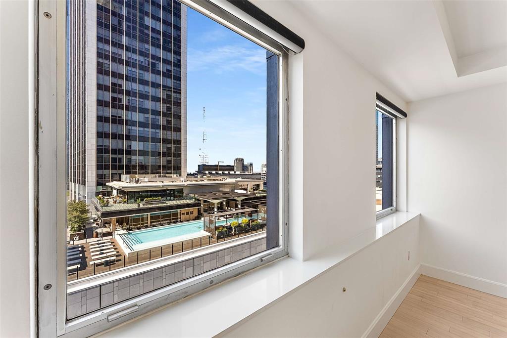 JUST REDUCED TO $300,000. THE SELLERS MEAN IT.
This price shouldn't exist in this building. The unit one floor up closed at $590,000. Same address, same views, same full-service luxury. After a long run on the market, the sellers are done waiting and have priced this home to sell now. This is the deal every buyer says they're waiting for.
Inside the George Dahl-designed 1505 Elm, this rare 3-bedroom, 3-bath home delivers everything you'd expect at twice the price. Start with the view: Dallas skyline out every window, plus a front-row look at the pool scene atop The National directly across the street — one of the better people-watching perches downtown. The kitchen is full Thermador with dual convection ovens, wine refrigerator, quartz counters, Italian tile backsplash, and ceiling-height custom cabinetry. Bamboo floors, Hunter Douglas automated blinds, built-in speakers with in-wall subwoofer, Nest and Alexa integration, and keyless entry. Private storage with built-in shelving sits directly across the hall.
Just 68 residences, and the building takes care of everything. 24-hour concierge and valet for residents and up to five guests (no tipping, ever). Rooftop pool with cooking pavilions, fitness center, theater, sauna, piano lounge, wine cellar with your own private locker in the original bank vault, and a private dog run. HOA covers all utilities except interior electric. True lock-and-leave living.
Steps from Michelin-recognized dining, the Arts and AT&T Discovery Districts, with DART Akard Station right across the street.
At $300K the price almost doesn't make sense, until you understand it. No catch, no gotchas. Just sellers who need a fast close and are giving you a deal. See it before someone else figures this out.