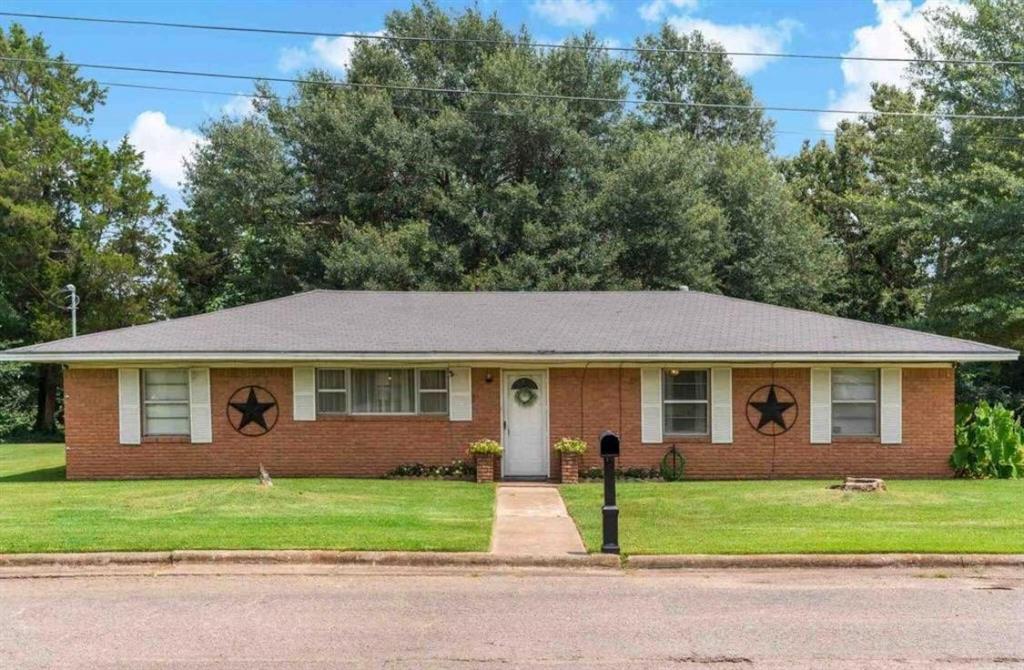 If you're looking for space, convenience, and value, this 4-bedroom, 2-bath home has plenty to offer! Situated on a generously sized lot within the city limits of Paris, Texas, this property provides 2,240 square feet of living space with room for everyone to spread out and enjoy.
Inside, you'll find durable tile flooring throughout the home, making maintenance a breeze. The spacious kitchen offers an abundance of cabinet and countertop space and opens to a large dining area that's perfect for family meals and entertaining guests.
The oversized primary bedroom features a charming decorative fireplace, creating a cozy retreat at the end of the day. Three additional bedrooms and a second full bath provide flexibility for family, guests, a home office, or hobbies.
Outside, mature shade trees enhance the curb appeal and provide a beautiful setting for outdoor enjoyment. The 2-car carport offers covered parking, while the large lot provides plenty of additional parking space for guests, recreational vehicles, or extra vehicles.
Conveniently located near shopping, dining, schools, and other city amenities, this property combines space, comfort, and practicality in one attractive package. Seller will owner finance.