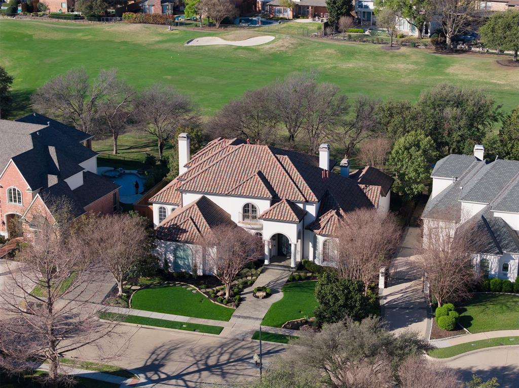 GOLF COURSE VIEWS! Perfectly positioned along the golf course in Pebble Brook @ Willow Bend, this spectacular 4-bed estate offers refined living w. breathtaking fairway views, a resort-style pool & exceptional indoor-outdoor entertaining. Step inside to hand-scraped wood floors thru-out the main lvg areas, solid-core doors & enterprise-grade Ubiquiti networking pro installed for seamless connectivity. The elegant entry is flanked by versatile formal lvg or dng on left & private exec office w. custom BI on right. At the heart of the home, the lvg rm impresses w. soaring 2-story ceiling, FP & dramatic wall of windows framing the sparkling pool & golf course beyond. The open-concept design connects the liv area effortlessly to the brkfst room & chef’s kitchen, creating ideal space for both everyday living & entertaining. The kitchen is a true showpiece, anchored by a massive island w. seating for 5 & equipped w. prem appliances incl. 6-burner Wolf range w. dbl oven, Sub-Zero fridge & BI Miele coffee system. The adjacent fam rm features removable bar, BI storage, ice maker, wine fridge & kegerator for effortless hosting. The private owner’s retreat is a luxurious sanctuary w. its own FP, serene sitting area overlooking golf course & spa-inspired bath w. soak tub, sep vanities & expansive WI closet w. custom storage & center island. An flex room offers space for home gym or added storage. A 2nd bed on main level incl. an ensuite bath w. direct pool access. Upstairs, a spacious game rm w. beamed ceilings & dng area opens to balcony w. sweeping golf course views. A bar w. kegerator, mini fridge & ice machine makes this space perfect for entertaining. 2 add. beds each w. private ensuite & WI closet. Outdoors, covered patio w. BI kitchen overlooks heated pool & spa, creating a private bkyrd retreat set against the lush golf course backdrop. The 3-car garage incl. a Level-2 EV charg. station, completing this thoughtfully appointed home designed for both luxury & convenience.