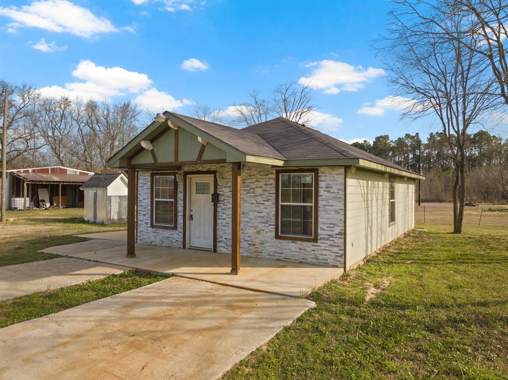 Just outside of Mount Pleasant, this versatile 3-bedroom, 2-bath home sits on 3.691 gated acres offering privacy, functionality, and exceptional flexibility. Conveniently located near Interstate 30, you’ll enjoy quick access for commuting, with the Dallas area just approximately 1 hour and 20 minutes away. The main residence provides comfortable living with a practical layout ideal for everyday life. Beyond the home, the property truly sets itself apart with an impressive, oversized shop featuring two roll-up doors—perfect for equipment, vehicles, or business use. The shop includes its own bathroom, two additional bedrooms, and a kitchen area, making it ideal for guest quarters, extended family, rental potential, or a home-based business setup. RV owners will appreciate the dedicated RV hookups and covered parking area located just outside the shop, offering convenience and protection year-round. With secure gated entry, expansive acreage, and multi-use improvements, this property delivers the rare combination of residential comfort and commercial-grade functionality—just minutes from town but with the space and freedom of country living.
