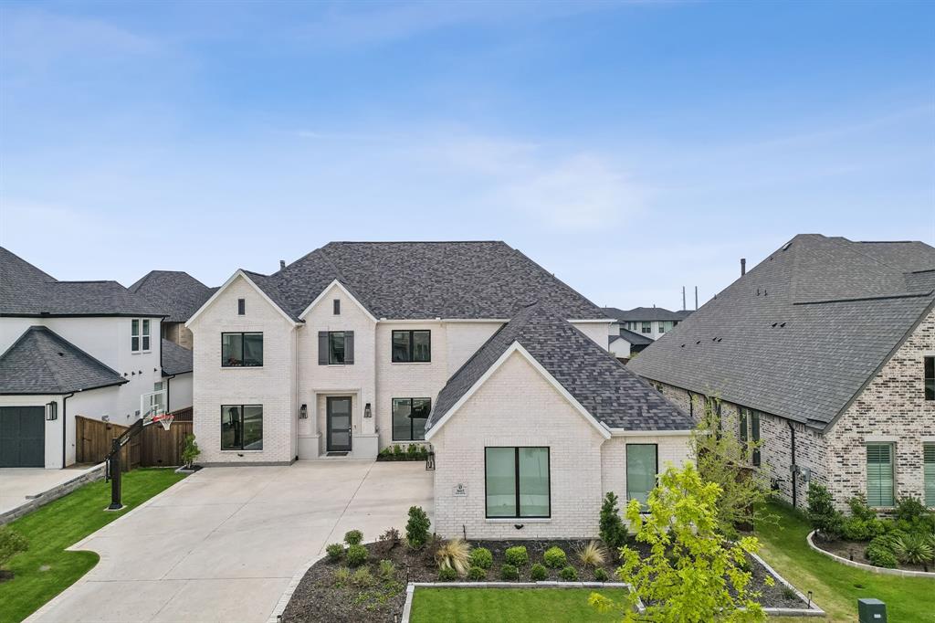 Experience the epitome of luxury in this NE facing transitional Shaddock-built pool home located on a premium greenbelt lot in the esteemed Edgestone at Legacy. The attention to detail is evident w soaring ceilings, abundant natural light, wood tread stairs, neutral LVP flooring, electric window shades, & a 4-car garage. The well-designed layout has 5 spacious bedrooms incl a 2nd floor junior suite complete w sitting area & luxurious bathroom; dedicated home office; game & theater rooms. The gourmet kitchen offers cabinets & backsplash to ceiling, gas cooktop, spice racks, WI pantry, & large island w seating. The private primary suite includes a sitting area + spa-like bath w walk-thru shower, free-standing tub, separate vanities, & a WI closet. Upstairs, you’ll find 3 generously sized bedrooms, game room, & media room. Outdoors enjoy a covered patio w electric screen, sparkling saltwater pool + spa, artificial turf, & upgraded landscape. Attends Frisco ISD. Ideal location in W Frisco.
