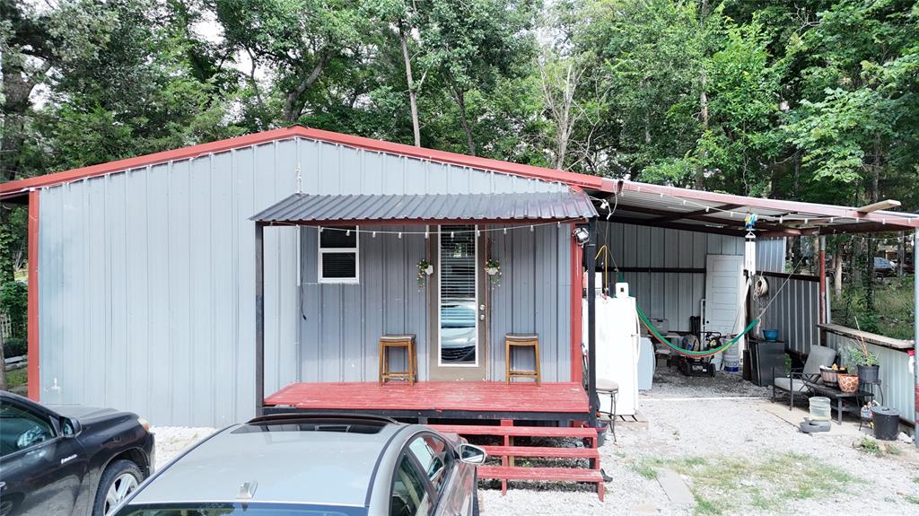 Discover the potential of this unique opportunity located outside city limits, offering flexibility, privacy, and room to grow. The property features a 2 bedroom, 1 bathroom metal structure that was originally intended as a temporary living space and is ready for its next owner to bring their vision to life. Whether you're looking to finish out the existing structure as a residence, create a guest house, workshop or utilize it while building your dream home, the possibilities are endless. The property includes a large gated entrance for added security, fully fenced and a large backyard space with many trees. Conveniently located near FM 751, you'll enjoy easy access to the Hunt County Trade Center, local restaurants, shopping, and all the recreation that Lake Tawakoni has to offer just minutes away. No current survey. Buyer and buyers agent to verify all measurements, utilities, schools and restrictions.