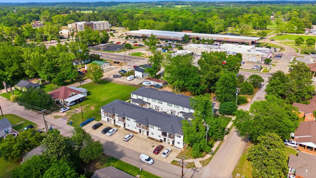 This recently built apartment complex in Lindale offers a rare opportunity to own a fully occupied, income-producing property in a highly desirable and growing area. Consisting of two buildings with a total of 15 units, this well-maintained complex is 100% occupied and designed with both investor return and tenant comfort in mind. The unit mix includes eleven 2 bed, 2.5 bath units at 1,160 sq ft, along with four 1 bed, 1.5 bath units at 900 sq ft. Each unit features a fresh, modern design with spacious layouts and access to a private fenced backyard area - an added feature that sets this property apart and enhances tenant appeal. Tenants pay all utilities, helping maximize efficiency and simplify management. Ideally located in Lindale school district, the property is just minutes from local shopping, dining, and amenities, with convenient access to Tyler and I-20 for easy commuting to surrounding cities. With strong occupancy, desirable unit features, and a prime location, this is an exceptional investment opportunity in the heart of East Texas!