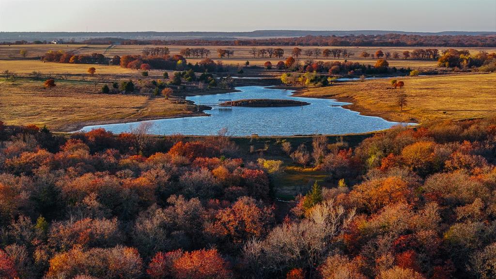 Nestled in the Cross Timbers of North Texas, discover the vast opportunities Ruby Ranch has to offer. This 126.83-acre ranch is an outdoorsman paradise, with remarkable hunting and fishing. The pinnacle of this ranch is the stunning 8-acre lake, complete with a dock and a boat slip. This lake boasts abundant Waterfowl and is fully stocked with adult largemouth Bass. Watch the sunset over this pristine lake from a spectacular building site nestled amongst mature post oaks. Improved coastal grasses and native grasses blanket the terrain of this ranch, with a mixture heavy brush quintessential for Whitetail Deer! Two seasonal creeks meander through the property, one that feeds a charming pond toward the entrance of the ranch. With a half mile of road frontage on FM 1288 this ranch is both easily accessible and secluded, offering co-op electricity and high-speed fiber optic internet! Conveniently located 15 miles from Bowie, 47 miles from Wichita Falls and 70 miles from Fort Worth.