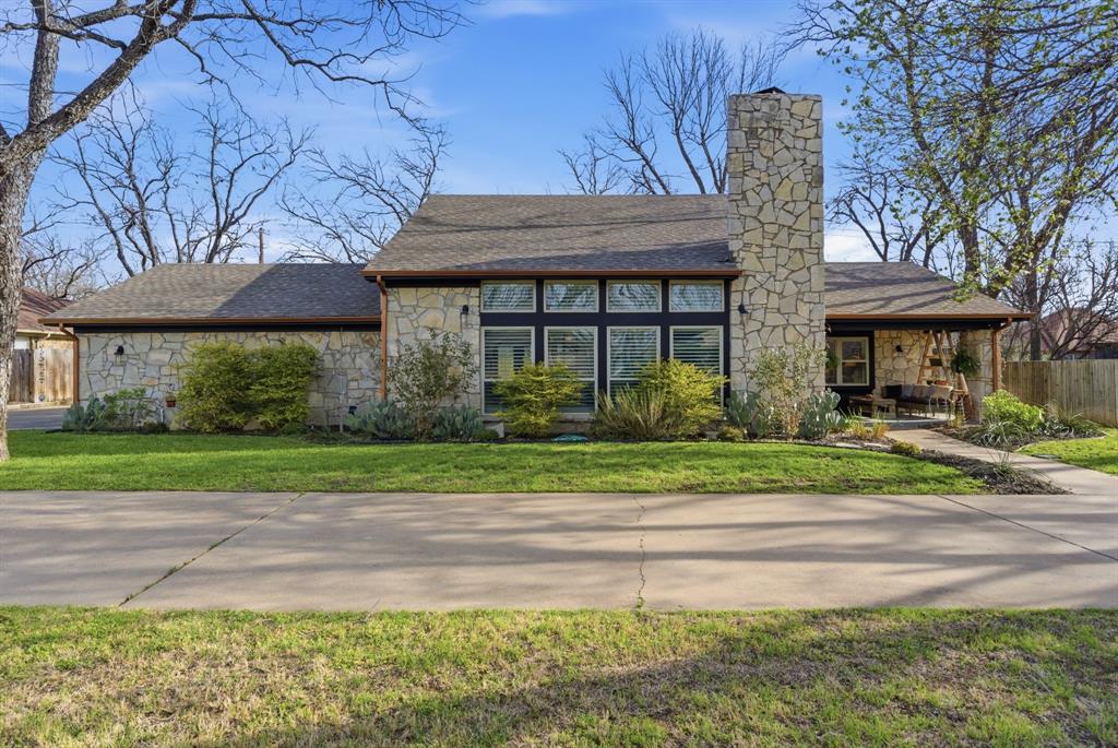 Stylishly updated 3 bedroom 3 bath home, in Pecan Plantation.  From the moment you enter, you’re welcomed by an elegant interior bathed in natural light through newer, energy-efficient windows. The living area features floor-to-ceiling windows and a striking floor-to-ceiling rock fireplace, creating a bright and inviting atmosphere. The gourmet kitchen boasts an island with seating, a coffee bar, and premium finishes, along with a bronze pot filler above the gas range.  Additional highlights include a home office, a large utility room and a pet retreat.  The primary suite includes dual closets a spa-like ensuite with dual sinks, walk-in shower and plenty of room, secondary bedrooms are upstairs with an updated adjoining bath.  Outdoors you will find a spacious manicured yard with iron fencing with 13 foot gate, privacy fencing to include a new rear fence, the concrete patio with pergola is great for outdoor entertaining or relaxing, complemented by the fire pit.  Residents enjoy the world-class amenities of Pecan Plantation, including a private golf course, multiple lakes, boat ramps, walking trails, tennis courts, and a clubhouse.  This you need to see.