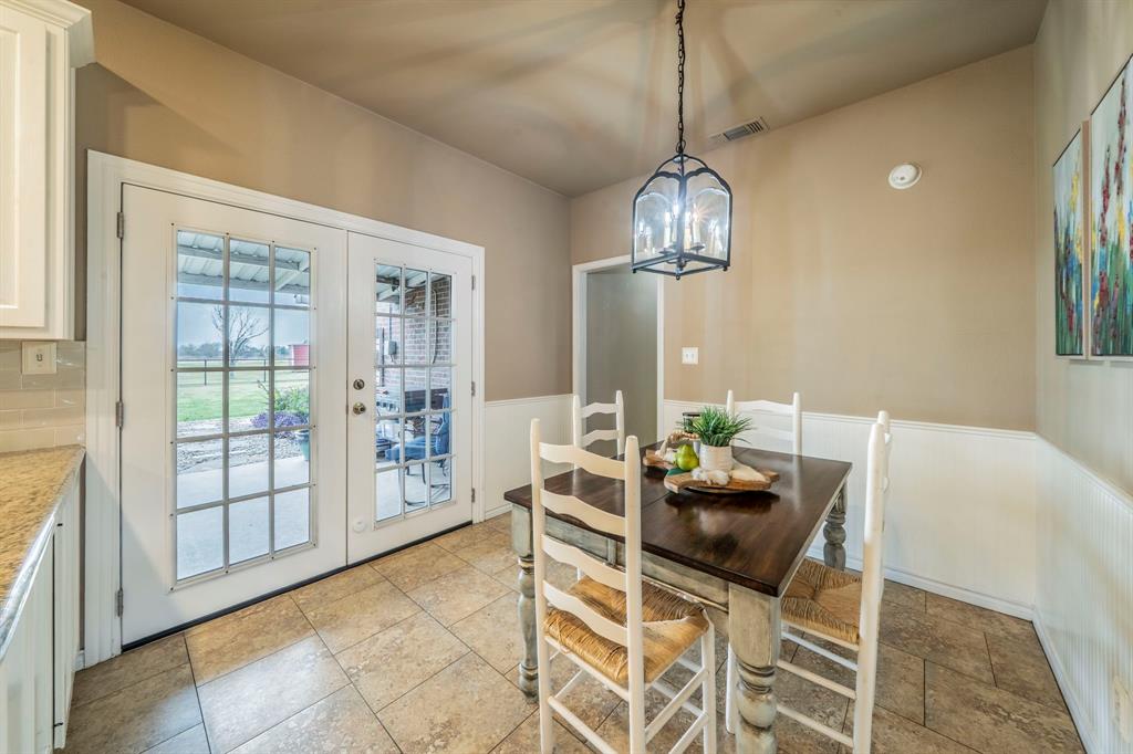 5 acres in Gunter.  HOA-no. MUD-no. PID-no.  Slice of heaven-YES! Finding a home with 5 acres, a second living unit, and storage is like finding a needle in a haystack.  Country living, but just minutes from shopping. Just a 5 min drive to Preston or 289.  The main house is 2,160 sq ft with 3 bedrooms, 2 full and one half bath, and an office or dining room. From coffee at sunrise to watching the game with friends to cooking out for gatherings on the large covered front and back porches will make this your Home Sweet Home.  There is a large unfinished room above the garage with a separate entrance, approximately 24x18.  The secondary unit is a complete living space with a 2-car carport.  This unit is 678 sq ft.  Great for extended family or can be used for income-producing.  The barn or workshop area with a large roll-up door has electric, water, and a toilet.  Backyard has a smaller fenced-in area for pets, and the remainder of the yard is open for so many options.  The fenced yard is pool-sized.   There is a small storage shed as well. Lot is 5 full acres.