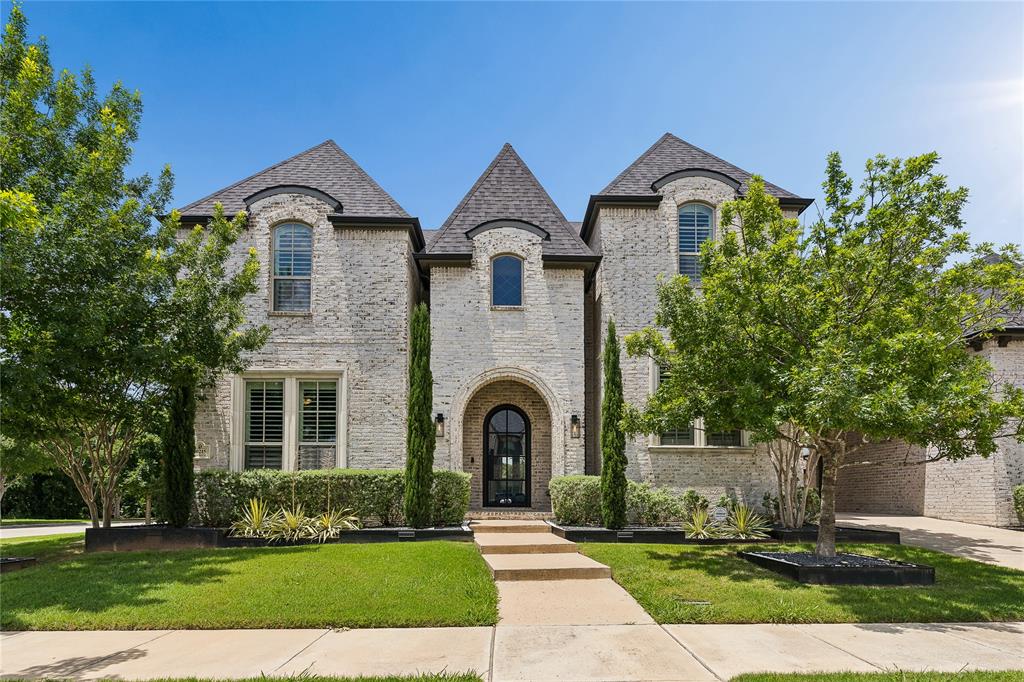 FRESH interior paint and carpet as of 6.15.2026! Welcome to one of Frisco’s most coveted addresses. Situated on a corner lot within the gated community of Shaddock Creek Estates, this custom 4,931 square foot residence offers 5 bedrooms, 5.1 bathrooms, a 3 car garage with Porte-Cochere, two first floor bedrooms, and a resort style backyard designed for entertaining, all while delivering the rare combination of privacy, security, and convenience just minutes from Frisco’s top dining, shopping, entertainment, and schools. From the moment you pass through the gated entry, you’ll feel the difference, this is a neighborhood where families ride tricycles on quiet streets, neighbors know your name, and the pace of life feels effortlessly relaxed. The home itself is designed for the way you live and entertain. A transitional design with subtle French influence unfolds through extensive wood floors, modern finishes, and thoughtful architectural details. The formal dining room, executive study, and sweeping staircase set a grand tone, while the chef’s kitchen features a double oven, 6 burner gas cooktop, range hood, oversized island, and walk through pantry, opening to the family room with floor to ceiling fireplace and breakfast room. These spaces flow to a resort style backyard with covered patio, fireplace, outdoor kitchen with plank ceiling, custom pool, and infinity edge spa. Two first floor bedrooms make the home highly functional. The primary suite overlooks the private backyard and includes a spa like ensuite with architectural ceiling details, while a secondary ensuite bedroom is ideal for guests or multigenerational living. Upstairs, three additional ensuite bedrooms join a game room and media room, offering space for everyone. Shaddock Creek Estates is surrounded by Cottonwood Creek Park w 68 acres of lakes, trails, and a fishing pond, and is just minutes from Frisco’s top dining, shopping, and schools. A true expression of luxury living in a prime Frisco location.