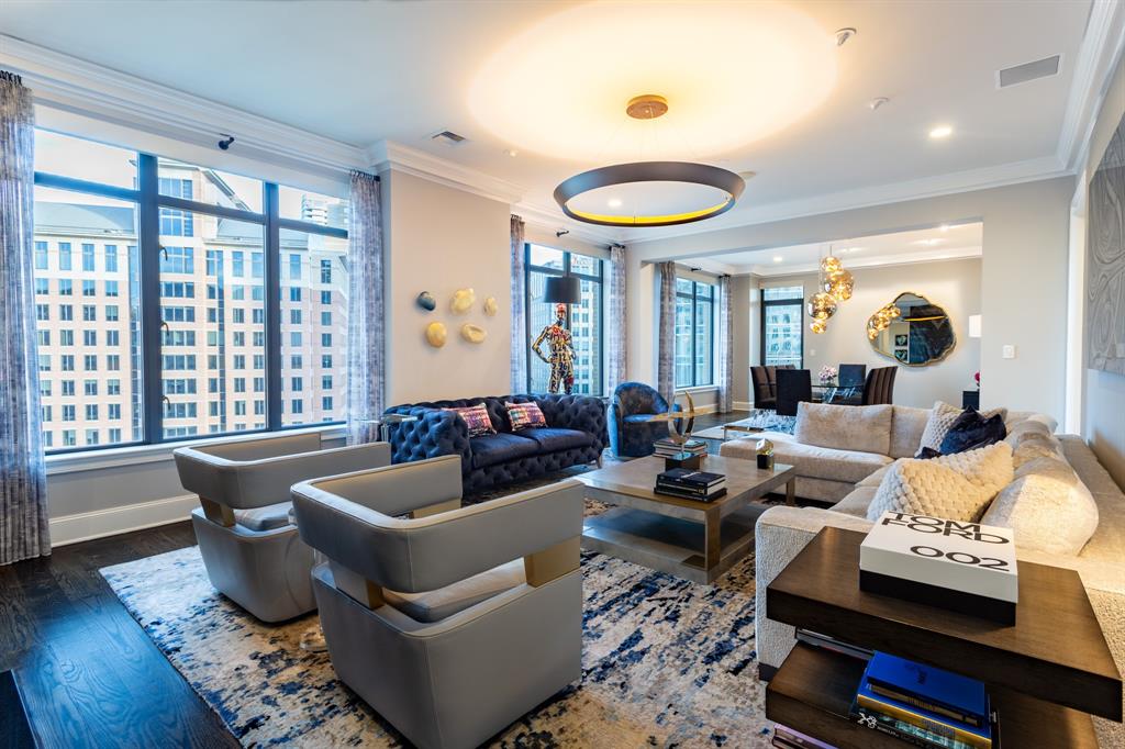 Rare RENOVATED Ritz-Carlton Residences!  Downtown facing corner unit.  Marble, stone & hardwood floors, granite & marble countertops, 10 ft ceilings, operable windows, SMART home system for lights, electric shades, Audio-Video system.  Inlaid marble double-door Entry opens to a large Living Room with a book-matched marble fireplace wall & custom halo light fixture.  Oversized Dining Room will accommodate a large family sized table, and has access to the corner Balcony with expansive views of Uptown, Downtown & sunset.  The fabulous Kitchen boasts Wolf & SubZero appliances, stone counters, custom lighting, full-sized pantry, a Wet Bar & a large Laundry Room.  There is a magnificent custom Theater room which could also be used as an Office.  The Primary Suite has an ensuite marble Bath with double vanities, a makeup table, garden tub, seamless double-entry shower with 2 shower heads, linen closet & 2 private water closets. The oversized Chanel Boutique-worthy Primary Closet is custom designed, outfitted & lighted.  The split Guest Suite has been opened-up & has an ensuite marble Bath.  Enjoy morning coffee or sunset cocktails from the corner Balcony.  Luxuriate in 5-Star Ritz-Carlton Hotel amenities including concierge, valet, room (food) service, elevated pool, fitness center, Reflection Fountain Park with outdoor grill, pet park, full-service 12,000 sq ft Ritz-Carlton Spa, award-winning Fearing's Restaurant, Rattlesnake Bar, & al fresco Live-Oak Dining & Bar with live entertainment on some weekends.  Nearby Crescent Hotel, Restaurant & Shopping Complex, Klyde Warren 5-acre Park, Victory Park & American Airlines Center, the #1 rated largest contiguous urban Arts District in the US with several Pritzger Award-winning architect designed buildings, the Design District, The Katy Trail hike & bike trail, CBD and a myriad of restaurants, shops, galleries & entertainment venues. Fashionable Uptown has a remarkable 93 walkability score.