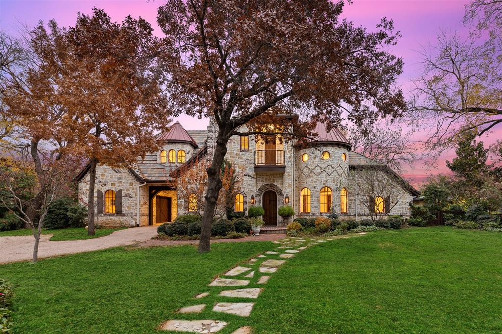 Charming English countryside style home on a wonderful, oversized 0.534 acre lot. This property sits in a coveted part of Bluffview on a cul-de-sac overlooking the bluff. Constructed in 2016, this 4,470 sf home has a stone and brick exterior. A charming motor court meets you as you enter the gated driveway. This estate was specifically landscaped with extensive trees, shrubs and perennials to showcase the properties grounds. A private master suite downstairs, with 3 additional bedroom upstairs. Hand scraped hardwood floors throughout living areas. Distressed wood island countertop, large copper farmhouse sink, and a La Cornue double oven range. The main living area opens onto a private oasis covered patio, fireplace, water feature and built in stone island grill.