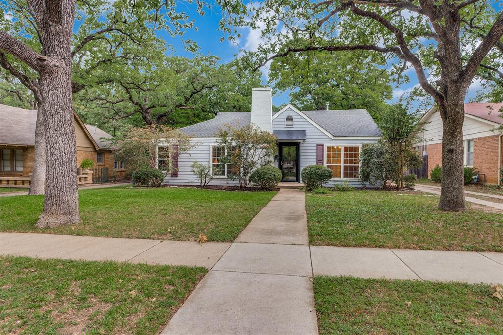 Nestled in the charming historic Oakhurst neighborhood, this home offers timeless curb appeal with mature trees, sidewalks, and inviting character throughout. Step inside to a spacious living room that is centered around a cozy gas-burning fireplace, creating the perfect gathering space. Featuring 2 generous sized bedrooms and 1 bath. The home also offers two dining areas — a formal dining room plus an eat-in kitchen area overlooking the oversized backyard. A warm and inviting bonus room with rich wood paneling and built-in bookcases provides endless flexibility as a second living area, home office, or add a closet to easily convert to a third bedroom. Architectural details like arched doorways and beautiful wood floors add to the home’s charm. The kitchen is both stylish and functional with a copper sink, granite countertops, gas range and abundant cabinetry.
Expansive backyard offers a bricked patio perfect for entertaining or relaxing. Garage with electric opener. Convenient access to I-35, Highway 287, and Highway 121.