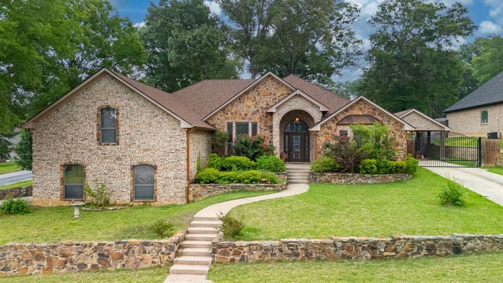 Welcome to 12360 Southhaven in Flint, Texas which is an exceptional 3-bedroom, 2-bath home perfectly positioned on a spacious corner lot with standout curb appeal and thoughtful upgrades throughout. From the moment you arrive, you’ll appreciate the attractive combination of classic brick construction, beautiful stone accents, and maintained flower beds that create a warm and inviting first impression. Step inside to discover a bright and welcoming interior featuring soaring ceilings, hardwood-look tile flooring. The open-concept layout is designed for both everyday comfort and effortless entertaining, offering seamless flow between the living, dining, and kitchen spaces.
The gourmet kitchen is sure to impress with stainless steel appliances, granite countertops, a center island, breakfast bar seating, and ample cabinetry for storage and functionality. 
The private primary suite offers a relaxing retreat with generous space and a well-appointed ensuite bath featuring double vanities, a garden tub, separate shower area, and a spacious walk-in closet. The master shower has a rainforest head with 3 additional shower heads and seating area. Two additional bedrooms provide flexibility for family, guests, or a home office.
Adding even more versatility to the home is an upstairs loft area with endless possibilities—perfect for a second living room, game room, or creative space. An unfinished bonus room provides exciting potential for future expansion; customize to fit your needs.
Step outside to enjoy a backyard built for entertaining and relaxation. Host weekend cookouts, sit around the fire pit or enjoy your fenced garden area with lean-to for garden tools and mower storage.  A detached carport offers valuable extra covered parking for additional vehicles, boats, trailers, or recreational vehicles. Garage features epoxy coated floor with a backup generator hookup under the circuit breaker.  Make this home YOUR home today!