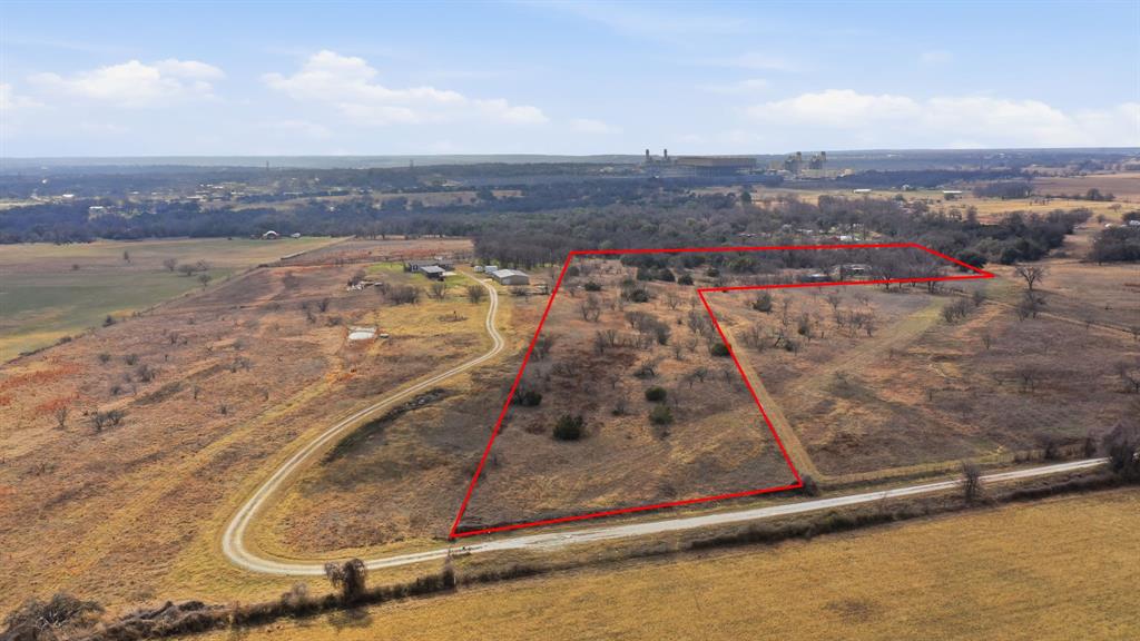Great opportunity to own 10 acres of gently rolling Hood County land with gated access and full perimeter fencing. Accessed by an all-weather road off Contrary Creek Road, this property offers a peaceful rural setting with a variety of potential uses. A 2026 survey is available. Existing structures, including the mobile home, are considered to have little to no contributory value and are being conveyed as-is. A well and septic system are present but have been inactive for several years; buyers should conduct their own due diligence regarding the condition, functionality, and suitability of all utilities and improvements. Conveniently located near Lake Granbury, Squaw Valley Golf Course, Stumpy's Lakeside Grill, Historic Granbury Square, and approximately 15 minutes from Glen Rose. All information is deemed reliable but not guaranteed. Buyer and Buyer's Agent to verify all information, including but not limited to acreage, taxes, schools, restrictions, utility availability, and the condition of any existing improvements.