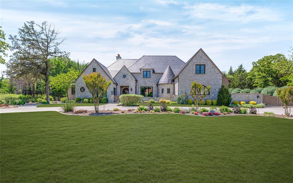 Welcome to 1520 Moss Lane, a stunning custom estate in the gated community of Moss Farms in Southlake. Set on over an acre in Carroll ISD, this 5,746 sq ft home offers timeless design, luxury finishes, and thoughtful functionality throughout.

The home features four spacious ensuite bedrooms with walk-in closets, four full baths, and two powder baths. The primary suite is a serene retreat with a private sitting area, spa-inspired bath with dual vanities, dual water closets, walk-in shower with body sprays, and a custom closet with direct access to the laundry room.

Elegant limestone tile flooring runs through the main living areas. The family room boasts real cypress wood ceilings and a full masonry fireplace with a marble mantle. The chef’s kitchen is equipped with two oversized islands, quartzite countertops, commercial-grade appliances, real cypress wood beams, and two pantries. A formal dining room with butler’s pantry and a bright breakfast room complete the space.

A dedicated office, additional workspace in the laundry room, and a game and theater room with full bar offer ideal spaces for work and play. Smart home features, electric shades, built-in speakers, and designer lighting enhance everyday living.

Enjoy year-round outdoor entertaining with a covered patio, fireplace, electric screens, built-in grill, and a pizza oven. The oversized jacuzzi and tranquil water feature complete the backyard oasis. Adjacent to a heavily wooded greenbelt, the property offers privacy and natural beauty.

Additional highlights include a four-car garage, full-house generator, and a fully encapsulated ~1,750 sq ft walk-up attic ready to be finished. This home is a rare opportunity to own a true luxury estate in one of Southlake’s most sought-after communities.