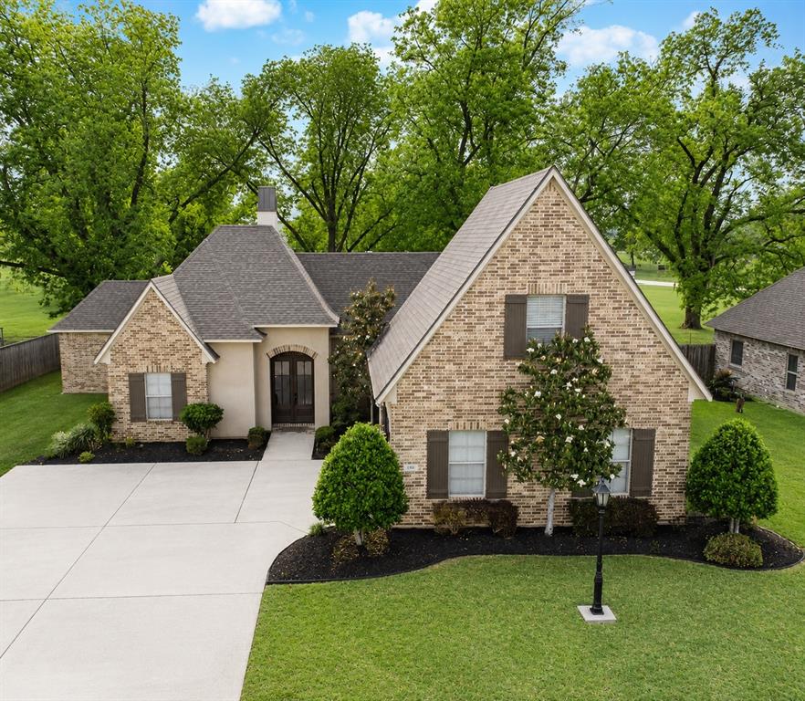 Welcome home to this stunning 4-bedroom, 3-bathroom property nestled in the highly desirable Magnolia Chase neighborhood in Benton. From the moment you step inside, you’ll appreciate the spacious open-concept design that seamlessly blends comfort and functionality. The heart of the home features a welcoming living area anchored by a cozy fireplace—perfect for relaxing evenings or entertaining guests. The oversized kitchen island with seating creates the ideal gathering space, while the eat-in kitchen offers everything you need for everyday living and hosting alike. The generously sized laundry room provides exceptional storage plus space for a second refrigerator or freezer—an added convenience you’ll love. Retreat to the serene primary suite overlooking picturesque pecan trees with no rear neighbors, offering added privacy and peaceful views. *NEW* aerial images highlight this view and the private backdrop enhancing the overall feel of this quaint neighborhood. Don’t miss the luxurious primary bath showcasing separate vanities, seating area, dual sinks, a beautifully tiled stall shower, separate classic claw foot soaking tub, and a spacious walk-in closet dreams are made of. Brand new 50 gallon water heater for added efficiency. 
Upstairs, the fourth bedroom and third full bath provide the perfect setup for guests, a private teen suite, or even a home office.
Step outside to enjoy the great patio area and partially fenced backyard—ideal for outdoor dining, pets, or simply enjoying quiet Louisiana evenings.
This Magnolia Chase gem combines thoughtful design, privacy, and space in one exceptional package. With just 52 homes in this single entry neighborhood, you’ll enjoy getting to know your neighbors while still maintaining your space and enjoying picturesque surroundings. Don’t miss your opportunity to make it yours!