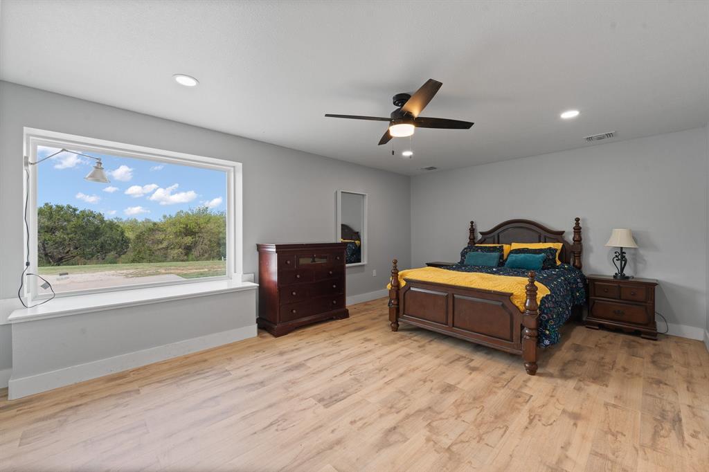 Welcome to 420 Overlook Drive, a private barndominium retreat on approximately 15 acres in Cleburne, offering space, privacy, and versatility just minutes from town.

Set among mature trees, this property provides a setting that is increasingly hard to find. If you are looking for seclusion, room to explore, or a place to unwind, this property delivers a different experience than wide open pastureland.

The home offers approximately 2,240 square feet with a functional 3 bedroom, 2 bathroom layout. Inside, you will find an open concept living area with soaring ceilings and a loft that overlooks the main space, creating a bright and inviting atmosphere. The kitchen is designed with ample cabinetry and workspace, making it practical for both daily living and entertaining. Roof replaced in Nov. 2025. 

The split bedroom arrangement provides added privacy, with a spacious primary suite that includes dual vanities, a walk in shower, and a freestanding soaking tub.

Outside, the land offers a mix of open areas and tree coverage, ideal for those who value privacy, recreation, or future customization. There is space for equipment, RV or boat parking, and the flexibility to tailor the property to your needs over time. A private well is already in place, along with access to a shared pond or tank.

If you are looking for a move in ready home with more square footage, a 3 bedroom layout, and a private setting with character, this property stands apart.

Conveniently located with easy access to Cleburne, Alvarado, and I 35.