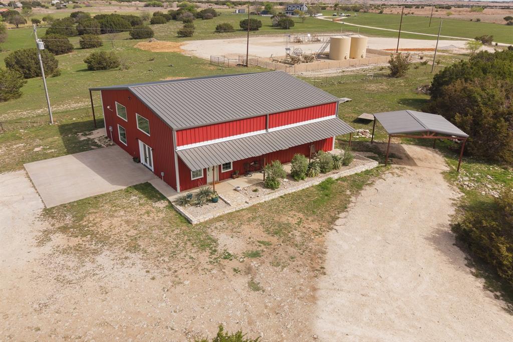 Welcome to 420 Overlook Drive, a private barndominium retreat on approximately 15 acres in Cleburne, offering space, privacy, and versatility just minutes from town.

Set among mature trees, this property provides a setting that is increasingly hard to find. If you are looking for seclusion, room to explore, or a place to unwind, this property delivers a different experience than wide open pastureland.

The home offers approximately 2,240 square feet with a functional 3 bedroom, 2 bathroom layout. Inside, you will find an open concept living area with soaring ceilings and a loft that overlooks the main space, creating a bright and inviting atmosphere. The kitchen is designed with ample cabinetry and workspace, making it practical for both daily living and entertaining. Roof replaced in Nov. 2025. 

The split bedroom arrangement provides added privacy, with a spacious primary suite that includes dual vanities, a walk in shower, and a freestanding soaking tub.

Outside, the land offers a mix of open areas and tree coverage, ideal for those who value privacy, recreation, or future customization. There is space for equipment, RV or boat parking, and the flexibility to tailor the property to your needs over time. A private well is already in place, along with access to a shared pond or tank.

If you are looking for a move in ready home with more square footage, a 3 bedroom layout, and a private setting with character, this property stands apart.

Conveniently located with easy access to Cleburne, Alvarado, and I 35.