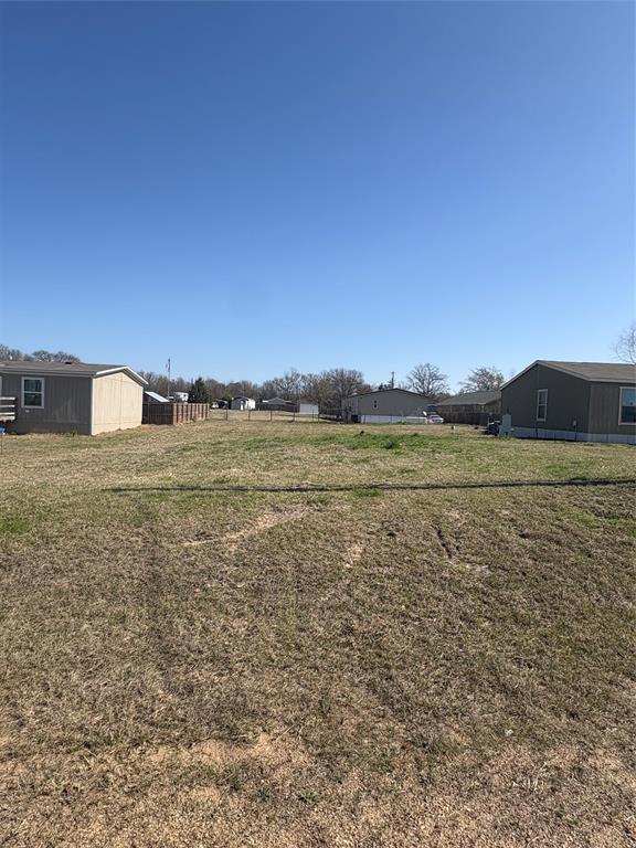Excellent lot inside the gated community of Holiday Villages of Lake Fork! This 50x150 lot is centrally located and offers a direct view of the community clubhouse right from the property. Just a short distance to the private boat ramp for quick access to the lake.

All utilities are available at the road (buyer responsible for tap fees). Flexible building options allow for a site-built home (minimum 750 sq ft), manufactured home, or RV. Deed restrictions apply.

Holiday Villages features outstanding amenities including a clubhouse, swimming pool, private boat ramp, fishing pier, basketball court, and community activities. Enjoy being minutes from world-famous Lake Fork — one of the premier bass fishing lakes in Texas.

Whether you’re looking for a weekend fishing retreat, full-time residence, or investment opportunity, this lot offers location and convenience inside one of Lake Fork’s most popular gated communities.