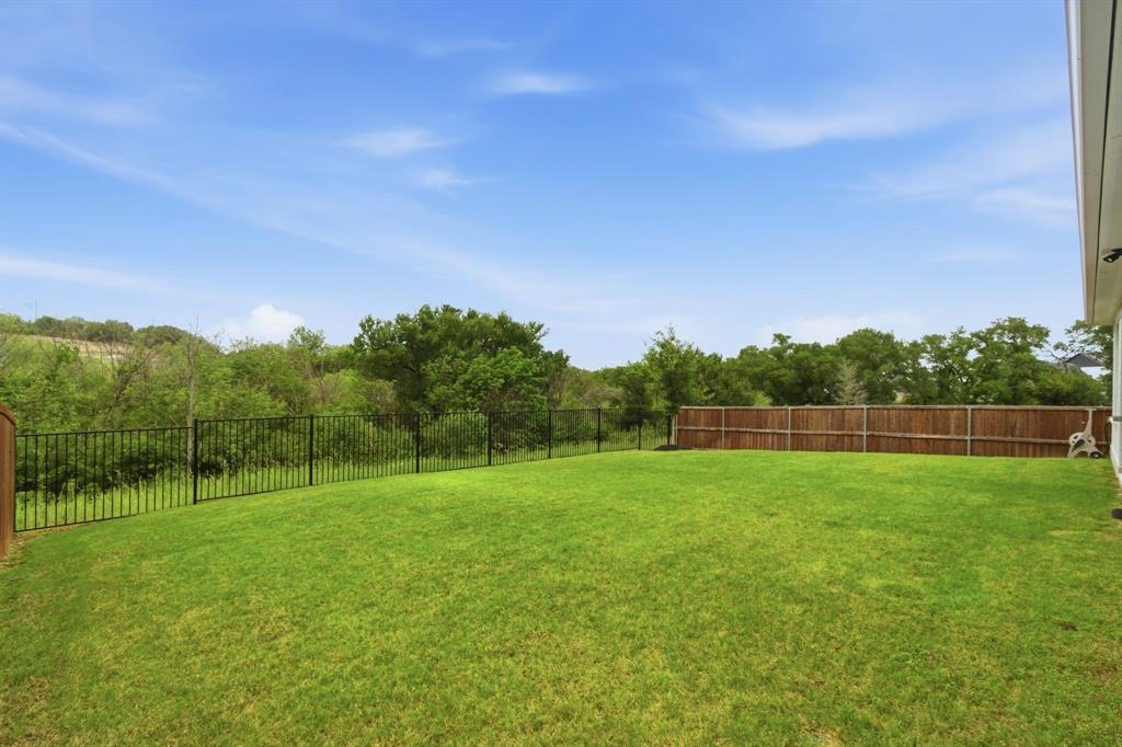 Tucked away on one of the most desirable lots in Talon Hills, 7217 Mantle Ridge offers the rare combination of privacy, style, and value. Backing to a peaceful greenbelt, this beautifully maintained 4-bedroom, 3.5-bath home with a dedicated office delivers an open-concept floor plan designed for both everyday living and effortless entertaining. The main living areas feature durable ceramic wood-look tile, creating a warm, cohesive feel, while the bedrooms offer plush carpeting for comfort.

This home shows like a model, with meticulous care evident throughout. Recent updates elevate both form and function, including fresh interior paint, updated door and cabinet hardware, and electric wireless Zebra blinds that add a modern, polished touch. Smart home features provide convenience and control, while an under-sink reverse osmosis system enhances everyday living.

Despite its like-new condition and thoughtful upgrades, this home is priced approximately $80,000 below comparable new construction, making it an exceptional opportunity to enjoy modern finishes and premium lot placement without the premium price tag. If you’ve been waiting for a move-in ready home with upgrades already completed and a setting that stands out, this is one you won’t want to miss.