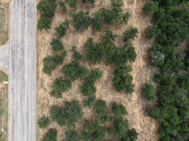 Discover the perfect place to build your dream home on this gorgeous lot filled with mature trees and natural beauty. Enjoy the peaceful setting, abundant shade, and privacy that only established trees can provide. This property offers a picturesque backdrop and plenty of space to bring your vision to life. Conveniently located with easy access to local amenities. Don't miss this opportunity to own a beautiful lot ready for your dream home.