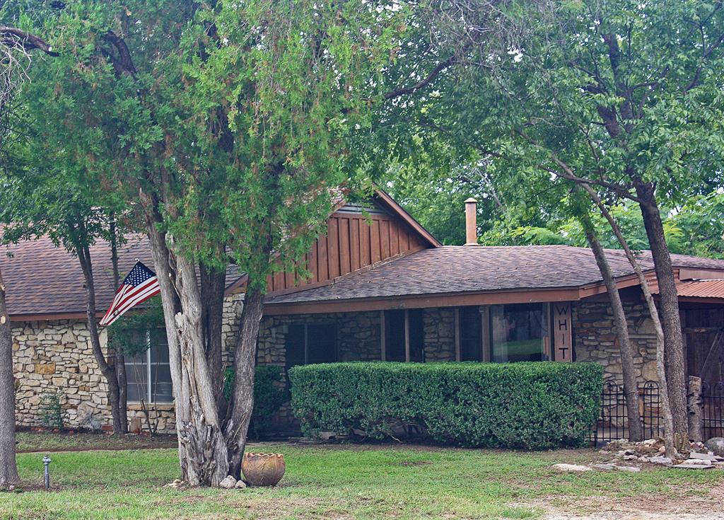 VERY UNIQUE property in a great location!  TWO lots are being sold together with a rock house and an old station.  House has great trees and a fenced yard.  Just a few blocks from the PALUXY RIVER WALK and the Historic Downtown Square with dining and shopping!  Square feet listed is total of 2 buildings on a total of 0.46 acres. The house at 305 Bryan has 2 Living Areas, 3 bedrooms, 2 baths.  The Station at 210 Austin has 2 large areas with 3  bays with roll-up doors, an office area, and 1 restroom.  With CITY-approval  it could be possible to re-zone the station to commercial, as it is currently residential.  Property is being sold as-is. Just minutes from the exceptional Glen Rose ISD, Fossil Rim Wildlife Park, Dinosaur Valley State Park, Squaw Valley Golf Course, Big Rocks Park, and other recreational activities!  (Commercial MLS Listing for 210 Austin #20966900)