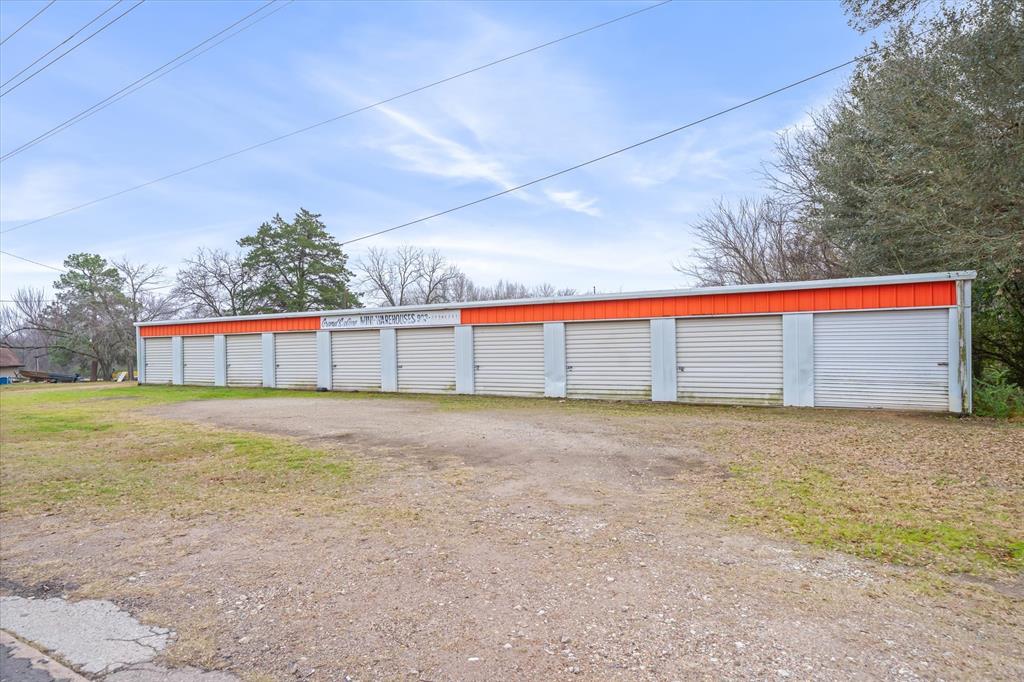 Turn-key and profitable 20-unit self-storage facility with room for more units on approximately 0.89 acres near downtown Grand Saline, just off the street of the grocery store in town. Ten of each, 10x10 and 10x20 units with metal construction, concrete slab, and roll-up doors for low maintenance and long-term durability. Units historically run about 90–100% occupied with many long-term, loyal tenants, providing steady monthly income with minimal day-to-day management. The property layout offers plenty of room to add additional buildings on the nearly 1-acre lot to significantly increase future rental income. High-visibility location near the main traffic corridor and grocery store creates strong drive-by exposure and consistent demand in this growing East Texas community. Van Zandt county's population has climbed over the last decade, supporting continued self-storage needs for residents, small businesses, and weekend visitors. All-metal walls and metal roof on concrete, plus individual metal roll-up doors, make this an easy-to-own asset with simple upkeep compared to many other commercial properties. Some additional potential for a new owner to have an even better upside remains through modest rent increases, basic social media marketing, and building out more units on the remaining land to maximize the site’s income potential. Ideal for an entry-level or seasoned investor seeking stable cash flow with expansion potential in a tight East Texas storage market.” New survey.