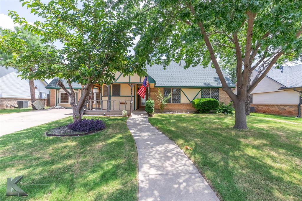 Welcome to this inviting 4-bedroom, 2-bathroom home located in a friendly neighborhood close to schools, restaurants, the zoo, parks, and shopping. The living room features vaulted ceilings and a classic brick wood-burning fireplace, creating a cozy and open space for gathering. The kitchen offers plenty of cabinet space and is filled with natural light—perfect for cooking, entertaining, or enjoying your morning coffee. Built-in storage adds convenience throughout the home. The garage has been thoughtfully converted into a large flex room—perfect as a game room, family room, office, playroom, or creative studio. The primary bedroom includes an ensuite bathroom with a stylish tiled walk-in shower. A private upstairs room offers a quiet retreat, ideal for guests or a secluded workspace. Enjoy outdoor living on the covered front porch or the expansive back deck, which includes a shaded area for warm summer days. The backyard is fully enclosed with a wood privacy fence and includes a storage shed, a firepit area, and plenty of space for entertaining or relaxing. Additionally, the property features a spacious workshop equipped with insulation, electricity, and a loft—perfect for projects, hobbies, or extra storage.