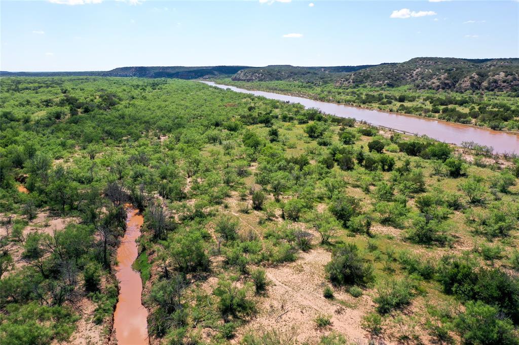 A great investment opportunity in Cottle County.  Big Jog Ranch is approximately 3,016 acres with good elevation changes for stunning views and excellent hunting.  There are three stock tanks on the property and the Pease River runs right through the middle.  Being surrounded by large ranches, this property is a great place for the avid outdoorsman.  The ranch is covered in mesquite, hackberry and cedar with a good road running throughout the ranch.  Excellent hunting for white-tailed deer, mule deer, turkey, quail, dove, hogs and varmints.  
The hunting camp offers a barn dominium with electricity and water supplied by King Cottle WSC.
The ranch is accessed off FM 2876 to County Road 360.  It is located 17 miles northeast of Paducah, 28 miles southeast of Childress, 130 miles northeast of Lubbock, or 222 miles northwest of Fort Worth.  
Seller owns a portion of the minerals and will convey minerals to buyer at closing.