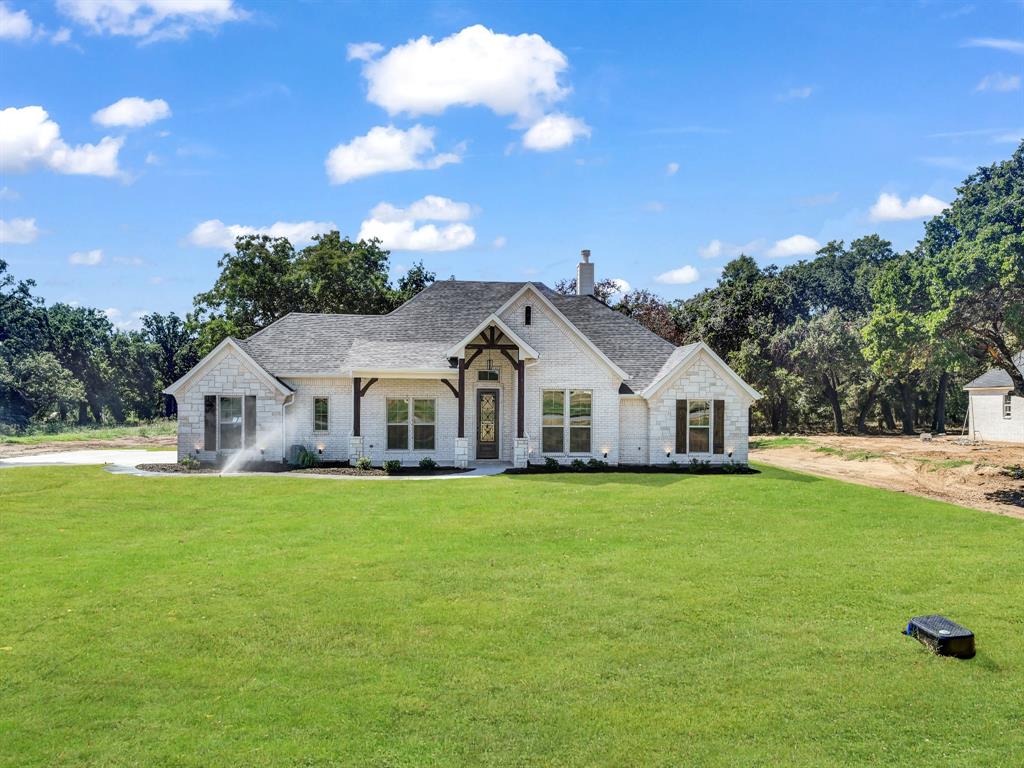 Charming LBK Home on 1 acre tract in Springtown ISD. This 2328 sq ft home has 4 bedrooms and 2 bathrooms with a dining room. This home has an open floor plan with split bedrooms. Large kitchen with ample cabinet space, large eat at island, quartz countertops, decorative light fixtures, and under mount lighting.Large living room, stone fireplace, large windows allowing great nature light. Large primary bedroom with primary bathroom boasting double vanities, separate shower and tub, and large walk in closet. Nice sized spare bedrooms with large closets. This homes has a 2 car garage with side entry and covered back patio. LBK Homes has all exterior walls spray foamed and CAT 6 hardwiring to all rooms for tv and streaming. Builder to pay title and survey.BUILDER OFFERING $10,000 CONCESSION!