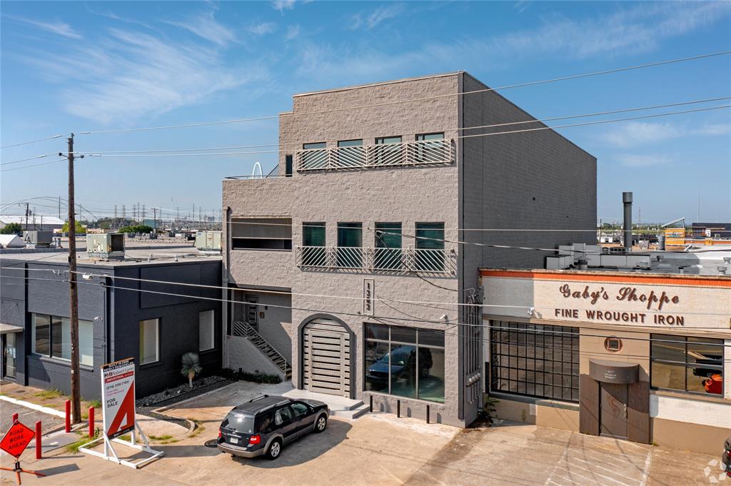 Introducing 1303 Dragon Street — a rare opportunity to own a fully renovated 12,500 SF mixed-use property with THREE Condos in the heart of the Dallas Design District, one of the city’s most vibrant and rapidly evolving neighborhoods. Built in 2006 and extensively upgraded in 2021, this unique asset combines 4,421 SF of ground-floor retail space with three individually deeded residential condominiums measuring 2,947 SF, 2,498 SF, and 2,634 SF. Each condo offers a private entrance, high-end finishes, and smart technology throughout, with added luxuries like a climate-controlled six-car garage and a private rooftop patio. The property also features 18 on-site parking spaces — a premium amenity in an area where parking is limited. Ideally positioned within walking distance to the Design District’s top restaurants, galleries, and nightlife, and just steps from The Seam — a 160,000 SF destination for upscale dining, retail, design, and wellness — this is a one-of-a-kind investment in an irreplaceable location. Whether you’re looking for a premier live,work,play setup, a flagship retail presence, or a long-term trophy asset with future upside, 1303 Dragon delivers unmatched versatility and value.