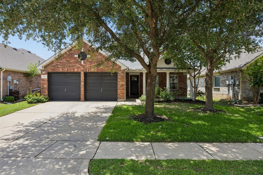 Welcome to 4941 Ambrosia Drive, a meticulously maintained and move-in ready residence that perfectly balances style and functionality. This 4 Bedroom, 2.5 Bath, 2 Living and 2 Car home is warm and inviting. Step in to the spacious living area, centered around a cozy gas fireplace—ideal for relaxing evenings. The heart of the home is an island kitchen - a chef’s delight - boasting a stainless steel sink, built-in microwave and electric range. With a convenient breakfast nook and pantry, it’s a space designed for both quick morning coffee and effortless entertaining.
All four bedrooms and two full bathrooms are located on the main level. Upstairs, you’ll find a large second living area equipped with a half bath, providing a flexible space that works beautifully as a media room, office or play area. The primary suite serves as a true retreat, with the added convenience of his-and-hers separate closets, an ensuite bath offering a garden tub for soaking, a separate shower and share vanity. The exterior features a landscaped backyard with a covered porch and an additional open patio, leaving plenty of lush grass area for kids, pets and outdoor enjoyment. Situated within the Keller ISD boundaries, this home also offers access and is located a short walk to fantastic community amenities, including sparkling pools, parks, and scenic hike-and-bike trails. This is a rare opportunity to secure a turnkey home in a vibrant, active community.