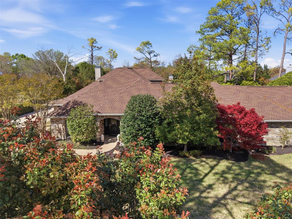 Amazing custom home! Located in the coveted Seis Lagos Neighborhood. Own a piece of Dallas history, Danny White the former QB for the Cowboys built this private retreat for his family. Custom features throughout the elegant home, including two fireplaces, one located in the spacious formal living area, and the other fireplace with a more rugged stone facade, located in the family room or den area. The master suite is a must see, oversized with additional sitting room complete with bookshelves. The master en-suite features separate sinks,  separate bathroom facilities, two large walk-in closets, an oversized jetted spa tub, and programmable shower with multiple functions. The kitchen is open to the breakfast area with extra counter space light and bright with sizable walk-in pantry granite counter tops and stainless appliances. Additional gym, flex space on the first floor, with an office space that has been used as a mother-in-law suite with access to the large patio, additional patio space originally a tennis court. Use your imagination ideal for a Pickle Ball court! The house is surrounded by mature trees and foliage to give additional privacy to the owners. This is absolutely a must see, plenty of space to make this an entertainers delight.