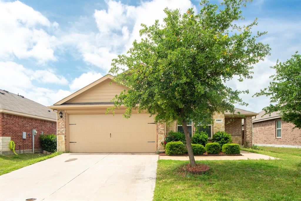 Welcome to this stunning 5-bedroom, 2-bath home designed for both comfort and style. Featuring a spacious open-concept layout, the kitchen, living, and dining areas flow seamlessly together—creating the perfect setting for everyday living, entertaining guests, and making lasting memories.
Durable ceramic tile flooring throughout the home provides a sleek, modern look while offering easy maintenance. The beautifully designed kitchen serves as the heart of the home, complete with granite countertops, abundant cabinetry, a stylish tile backsplash, stainless steel appliances, and an oversized island with a breakfast bar—ideal for casual dining, meal prep, and gatherings. The expansive primary suite offers a private retreat with an ensuite bath featuring a walk-in shower and elegant glass enclosure, creating the perfect space to relax and unwind. Step outside to the covered patio, perfect for year-round outdoor living—whether enjoying your morning coffee or hosting weekend get-togethers. Conveniently located near major highways, shopping, dining, and scenic Lake Ray Hubbard, this home also offers access to a vibrant community with outstanding recreational amenities. This home truly has it all—space, style, comfort, and location. Schedule your private showing today and experience everything this beautiful home has to offer!