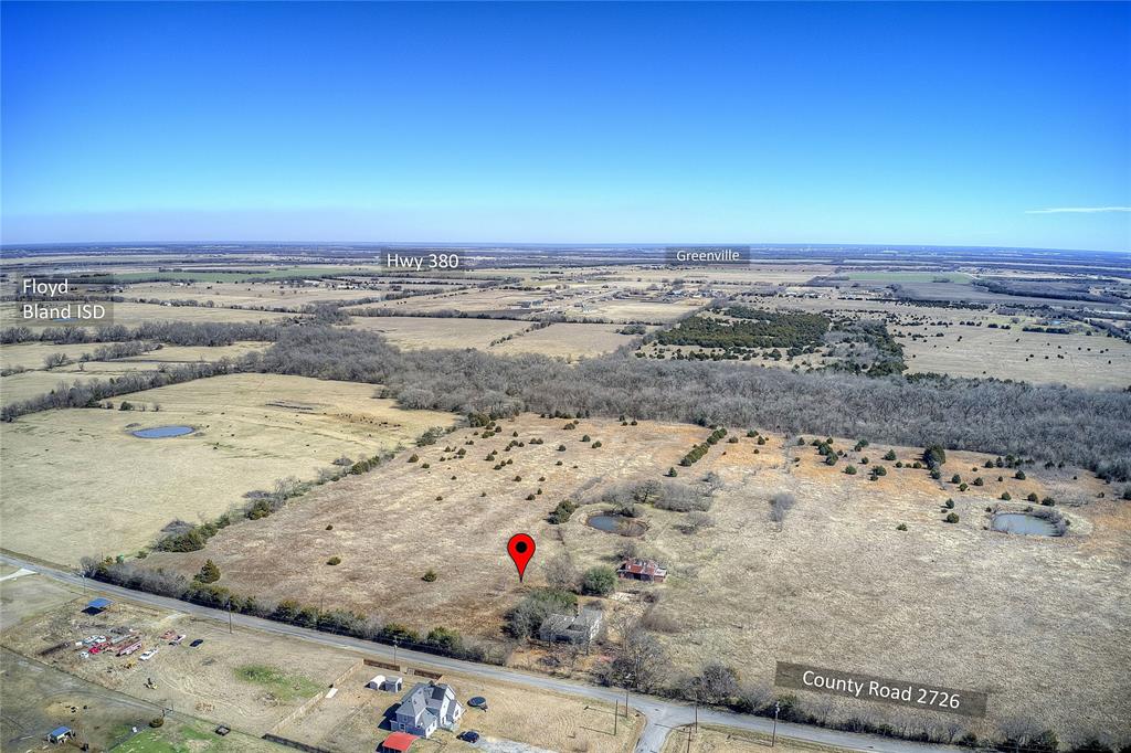 CALLING ALL DEVELOPERS!!! Approximately 51.5 Acres of stunning land located in prime area of Caddo Mills.  Investors and Developers Dream. Meandering creek running along side, a pond, and located on the corner of 2 FRONTAGE ROADS, CR 2727 AND 2726 and a Greenbelt along the back!  PERFECT FOR DEVELOPMENT.  There is a house on the property and an old barn, of which no value is given.  Fun Fact - Audie Murphy used to play in the barn on the property!

Sellers and Sellers agent not responsible for accidents if buyers want to look into the old house on property.