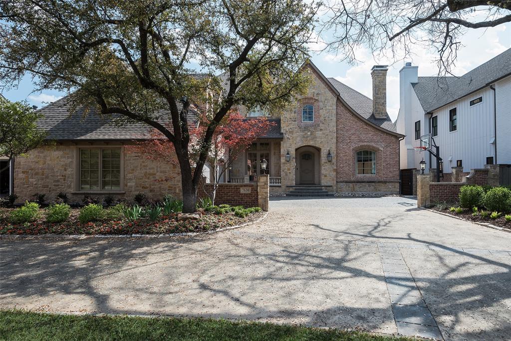 Situated on Southwestern Boulevard within a few blocks of Boone Elementary School , this well designed residence offers an blend of practical luxury and comfort. The home's thoughtful layout features four generously sized bedrooms, including a primary suite on the main floor accented with a vaulted, beamed ceiling, a sitting area and dual expansive closets. The spa-like primary bathroom has a separate walk in shower and garden tub along with separate vanities and sinks. The large entry hall has a dramatic 2 story ceiling. A cozy library-study to the right provides an intimate retreat with a fireplace and bookcases, while the dining room across the entry hall showcases the stunning lighting and wallpaper. The expansive family-living room is designed with a fireplace and many glass-shelved built-ins and gives easy access to the kitchen and breakfast room. There is a well-appointed butler's pantry with wine cooler and ice maker leading into a chef's dream kitchen equipped with a central island and an adjacent breakfast room bathed in natural light. Additional conveniences down include a dedicated laundry room with a sink and a nice office nook, walk in pantry, additional half-bath, a back staircase and access to the 3 car garage. Entertainment abounds on the upper level, featuring a fun media room plus a versatile-flex game room. Three bedrooms and 3 baths plus an entertainment bar complete the upper level. Step outside from the family-living room to the covered terrace overlooking the fenced and turfed backyard, an ideal setting for alfresco dining and gatherings. The home's three-car garage provides ample storage, while recent upgrades such as a new roof, hardwood flooring, designer light fixtures, window coverings and bespoke wallpapers, and a Reme Halo air purification system on the HVAC system underscore the property's commitment to quality and care.