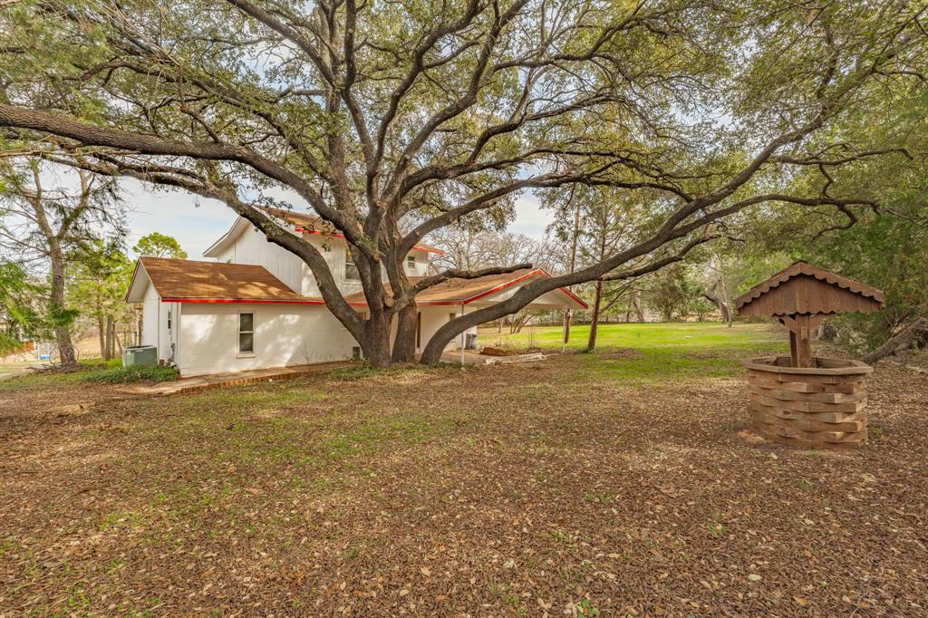 LAKE PROCTOR! This recently added onto 4 bdrm, 3 bath home boasts a roomy (approx) 2296 square feet with a large, adjacent, extra lot. As you can see in the pictures, the trees on this property offer so much added privacy and shade for warm weather days. This home, with cement construction stays well insulated year round, and the fireplace is a cozy bonus during the winter months. It's worth noting that the entire upstairs, with a full bathroom can be used as a primary suite with enough room for plenty of additional sitting area to enjoy your view of the lake. This property is waiting for you to put your own special special touches that make this a forever home, or even a weekend getaway. With co-op water and electricity, its also nice to have the well for irrigation needs.