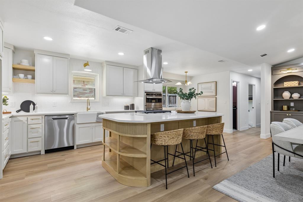 Reimagined by the Twenty One Group, 12124 Dixfield is a showstopping, move-in ready home that has modern style with everyday comfort. Perched on a hillside overlooking a leafy greenbelt and pocket park, this 3-bedroom plus office, 2.5 bath home welcomes you with wide-plank LVP flooring, designer lighting, fresh interior and exterior paint, and custom built-ins at every turn.

Enter the stunning kitchen, a centerpiece of the home with quartz counters, soft-close custom cabinetry, stainless appliances, and a striking built-in feature wall. Perfect for gathering and entertaining. The living room opens to serene treetop views, creating a calm, light-filled living space.

The primary suite is a private retreat, complete with double vanities and a luxe walk-in shower finished in dramatic tile. Outside, an oversized, newly landscaped backyard offers plenty of room for alfresco dining, play, or relaxing under the stars.

Thoughtful mechanical upgrades include energy-efficient windows, a tankless water heater, updated electrical, and durable PVC plumbing, all adding long-term value and peace of mind.

Boldly updated and beautifully finished, 12124 Dixfield is more than renovated it’s reimagined. Schedule your showing and fall in love with Lochwood living.