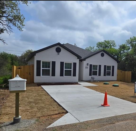 Just minutes from the beautiful Lake Granbury! This home features a well-designed floor plan with 3 bedrooms and 2 bathrooms. A large master bedroom and bathroom with beautiful granite countertops. Each room is equipped with ceiling fans for added comfort. The kitchen has elegant white cabinets, granite countertops, a nice kitchen island, stainless steel appliances (cooktop stove, dishwasher, microwave), and a corner pantry.  A spacious and elegant island kitchen with ample storage, featuring beautifully crafted drawers for organization. The island serves as a centerpiece, offering a stylish and functional space for cooking, dining, and gathering. With a sleek cooktop stove, modern appliances, and well-placed lighting, this kitchen combines practicality with sophistication, making it perfect for both everyday use and entertaining. Efficient appliances and LED lighting throughout the home—brick exterior. Fenced (6 feet tall), 2 Louver vents decoration in front of the house and . wooden shutters on all windows. The property includes an existing survey and a completed appraisal. Close to downtown shops, medical centers, schools, restaurants, churches, highways, and more. You won't have to go far for anything you need! See it, you'll love it!
Note: Tenant-occupied. Advance notice required for all showings due to a protective dog on the property. No unannounced showings. Do not disturb tenant. Photos were taken prior to occupancy; current condition may include tenant belongings.