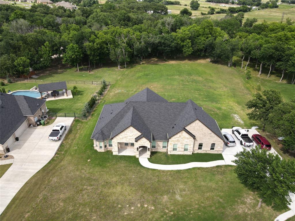 Welcome to 3248 N Cardinal Rd, Reno, TX 76020, a stunning newly built home completed in 2025 that perfectly blends modern design, comfort, and functionality. Situated on approximately 2.7 acres, this exceptional property offers the perfect balance of spacious country living with convenient access to nearby amenities.

This beautifully crafted residence features 5 bedrooms, 3 full bathrooms, and 1 half bathroom, providing ample space for family living and entertaining. The thoughtfully designed floor plan is filled with abundant natural light, creating a bright and inviting atmosphere throughout the home.

The luxurious primary suite serves as a private retreat, showcasing a spa-inspired bathroom with a freestanding soaking tub, separate vanities, and elegant finishes. One of the secondary bedrooms offers direct access to a full bathroom, making it ideal for guests, multigenerational living, or a private suite arrangement.

Step outside to enjoy the covered patio, complete with a ceiling fan, creating the perfect setting for relaxing or entertaining year-round. The expansive acreage provides plenty of parking space for vehicles, recreational equipment, boats, or RVs, while still offering room to enjoy the outdoors.

Located in the desirable area of Reno, Texas, this remarkable property combines the appeal of new construction, generous living space, and acreage living into one exceptional opportunity. Don't miss your chance to own this beautiful home.