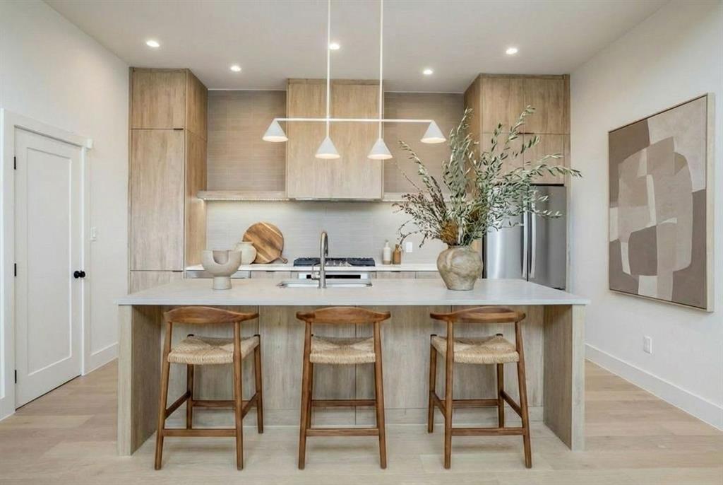 Experience modern luxury living at its finest in this exquisite contemporary new construction home, offering sleek design, exceptional craftsmanship, and an unbeatable location just minutes from downtown. Thoughtfully designed with an open concept layout, this home is perfect for both everyday living and effortless entertaining.

The chef’s kitchen is a true centerpiece, featuring stainless steel appliances, quartz countertops, a walk-in pantry, and gorgeous floors that add a sophisticated, modern touch. Tall ceilings and expansive windows flood the home with abundant natural light, creating a bright and inviting atmosphere throughout. Built with the highest level of energy efficiency in mind, the home includes complete foam insulation for superior comfort and performance.

The spacious primary suite is a private retreat, highlighted by elegant European oak wood flooring and a luxurious en-suite bath. The spa-inspired bathroom boasts an oversized walk-in shower, double vanities, a soaking tub, and generously sized walk-in closets designed for both functionality and style.

Tall sliding doors seamlessly connect the indoor and outdoor living spaces, opening to a covered patio and a private backyard enclosed by an 8-foot cedar fence ideal for relaxing, entertaining, or enjoying peaceful evenings at home.

Located just steps from the Santa Fe Trail and only minutes from Downtown Dallas, Lower Greenville, Deep Ellum, and White Rock Lake, this property offers the perfect balance of urban convenience and neighborhood charm. Become part of the exciting urban transformation taking place in the Mount Auburn neighborhood.

The adjoining unit is also available for purchase, presenting a rare opportunity for investors or those seeking multi-unit ownership. With strong rental and short-term rental potential, this property offers both luxury living and outstanding investment upside.