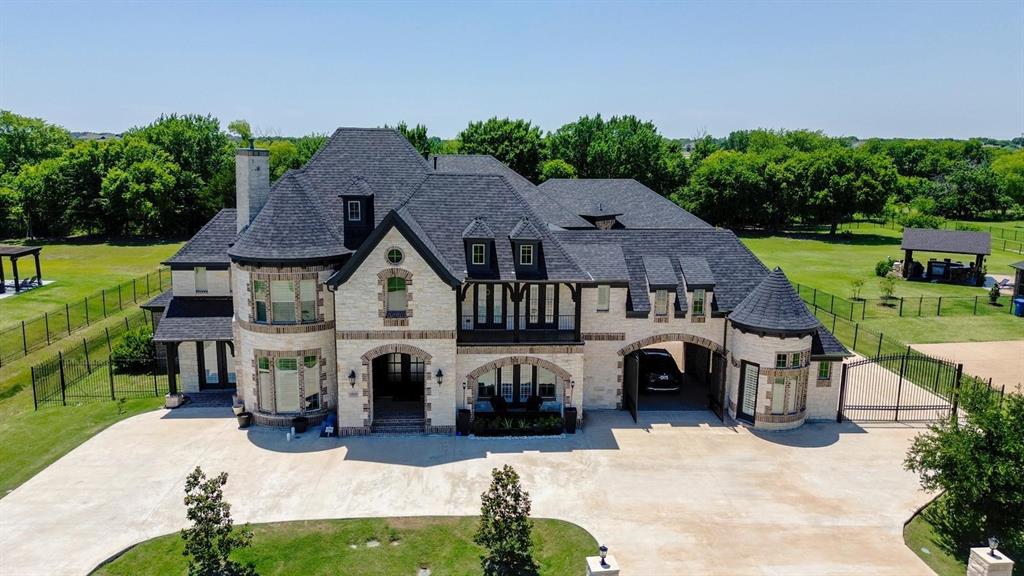Welcome to this exceptional luxury North East facing residence in the highly desirable town of Parker, where timeless elegance, quality craftsmanship, and over $460,000 in premium upgrades create an extraordinary living experience. Situated on a beautifully landscaped oversized homesite, backed to the Green Belt this remarkable home offers the perfect blend of sophistication, comfort, and functionality.

A grand entrance welcomes you with soaring ceilings, rich hardwood flooring, designer chandeliers, custom lighting, and abundant natural light throughout. The open-concept floor plan is thoughtfully designed for both everyday living and entertaining, featuring spacious living areas, a dedicated executive office, game room, media room, and generously sized bedrooms.
The chef-inspired kitchen is the heart of the home, showcasing upgraded cabinetry, an oversized island, premium stainless steel appliances, gas cooktop, farmhouse sink, walk-in pantry, and abundant counter space. The kitchen opens seamlessly to the expansive family room highlighted by a stunning floor-to-ceiling fireplace. The luxurious primary suite offers a private retreat with a spa-like bath featuring dual vanities, a soaking tub, oversized walk-in shower, and a custom walk-in closet.
Step outside to your own private backyard oasis featuring an impressive custom resort-style pool valued at approximately $180,000, complemented by approximately $75,000 in professionally designed outdoor living enhancements, creating the ultimate setting for entertaining family and friends. Additional exterior improvements include custom concrete work, beautifully enhanced front landscaping, and elegant custom entry gates.

Schedule your private showing today and experience luxury living at its finest.