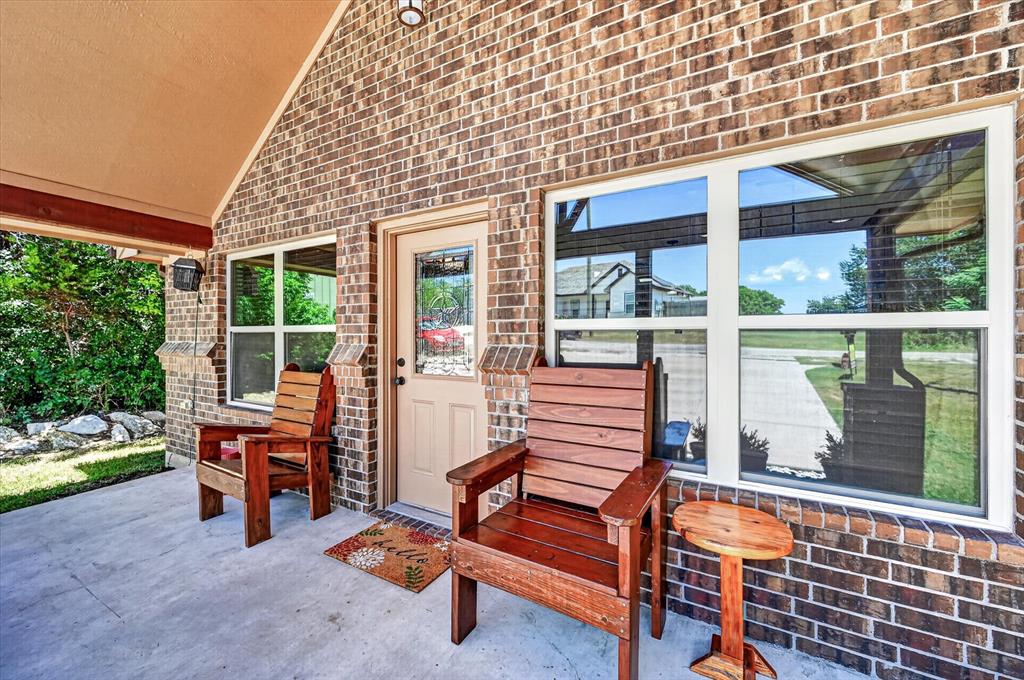 Welcome to your Granbury getaway. This beautifully designed 2-bedroom, 1-bath home offers the perfect blend of modern comfort and lake-community charm. From the moment you arrive, the inviting covered front porch, cedar accents, and attractive brick exterior create incredible curb appeal.

Inside, you'll love the open-concept layout featuring soaring ceilings, a stunning cedar beam, abundant natural light, and new wood-look luxury vinyl plank flooring throughout. The thoughtfully designed floor plan makes the home feel spacious while maximizing every square foot.

Located in the desirable Comanche Cove community, you'll enjoy easy access to Lake Granbury, public boat ramps, marinas, fishing, parks, and the shopping, dining, wineries, and entertainment of Granbury's historic downtown square. Whether you're searching for a full-time residence, weekend lake retreat, or investment opportunity, this property offers exceptional flexibility in one of Granbury's most popular lake-area communities. Weekend getaway. Full-time home. Investment opportunity. This one checks every box.

Don't miss your opportunity to own an affordable piece of the Granbury lifestyle! Professional photos coming soon.