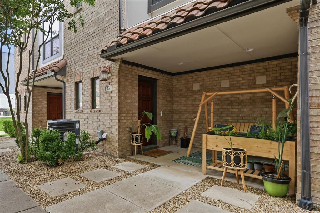 Experience stylish urban living in this beautifully upgraded 3-story condo near the Galleria, Addison, and major Dallas hotspots. Nestled inside a gated community, this move-in-ready home offers low-maintenance living, modern upgrades, and unbeatable convenience. The open-concept second floor is designed for entertaining with abundant natural light, hardwood flooring, and a spacious living and dining area flowing seamlessly into the kitchen. The kitchen features refinished and custom-painted cabinetry, upgraded hardware, granite countertops, stainless steel appliances, gas cooking, upgraded water filtration system, and an oversized island ideal for gathering with friends and family. The living area has upgraded lighting, a modern ceiling fan, and custom wall cabinetry for added storage and style.
Retreat to the spacious primary suite with upgraded lighting, ceiling fan, redesigned custom walk-in closet with built-in storage and enhanced lighting, plus a renovated spa-inspired bathroom with new tile flooring, expanded storage closet, and oversized walk-in shower with pony wall. The secondary bedroom also includes upgraded lighting and ceiling fan, while the guest bath features upgraded towel racks and added storage solutions. Additional upgrades include enhanced hallway lighting, upgraded laundry room storage and cabinetry, plus a custom wooden front porch swing and raised plant boxes creating a cozy outdoor sitting area. Major exterior improvement includes a full roof replacement completed in May 2026. Enjoy resort-style amenities including a sparkling pool, outdoor lounge, fireplace, and grilling station. Conveniently located minutes from the Dallas Galleria, Addison restaurants, shopping, nightlife, corporate offices, Dallas North Tollway, and 635, this location is ideal for professionals, roommates, or anyone wanting an easy lock-and-leave lifestyle in North Dallas near DFW and Love Field Airports. Schedule a showing today. OPEN HOUSE EVERY DAY!