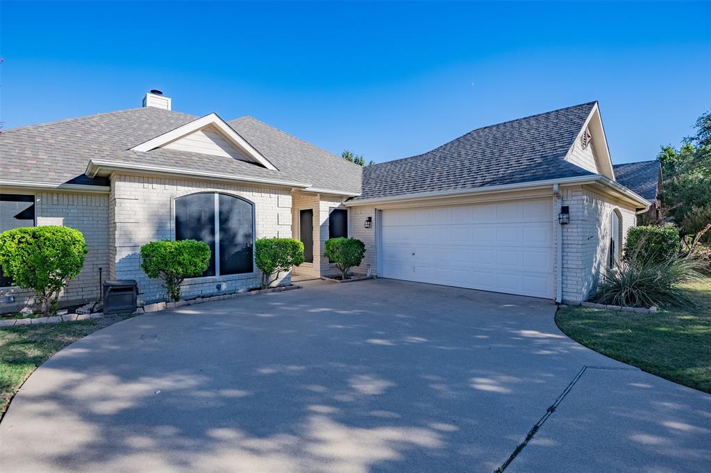 Welcome to your dream home! This 3-bed, 2-bath beauty boasts mature landscaping, gutters, and solar screens for energy efficiency. A side-entry garage and sidewalks add charm and great curb appeal. Inside, find neutral paint, ceramic tile, and laminate flooring making this an easy move in property. The kitchen features a breakfast bar for casual dining, while a wood-burning fireplace adds rustic elegance. The primary bedroom stands out with a barn door and offers a dual vanity, separate shower, garden tub, and a spacious walk-in closet. Practical touches include 2-inch blinds, ceiling fans, back patio and privacy fence. Enjoy a nearby neighborhood park for relaxation and recreation. Don't miss this opportunity to make this house your forever home. It has everything you need and more! Schedule your visit today!