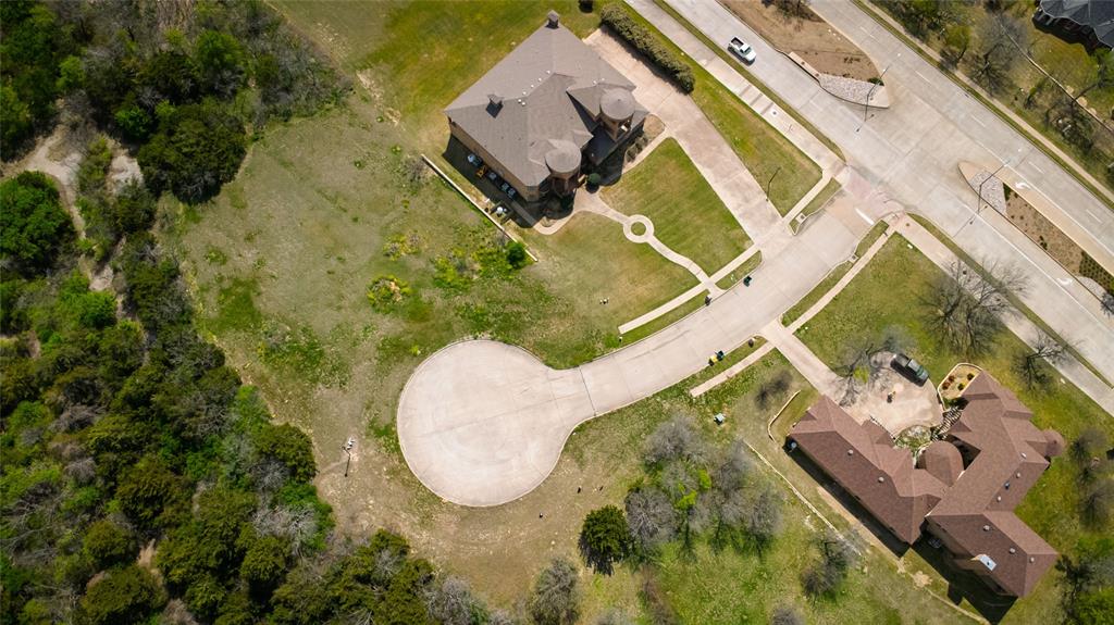 Stunning 2-acre lot featuring mature trees and breathtaking views. This prime residential site offers the potential for lake views from a second-story build. Located in a serene cul-de-sac with a ravine and hillside, this property is just minutes from Joe Pool Lake, Tangle Ridge Golf Club, and a sports park. An available survey is also included. A fantastic opportunity for your dream homesite!