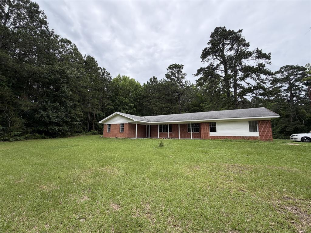 Tastefully remodeled home on 3.7 acres outside the city limits.  Has a gate coming off of the highway.  Plenty of room for your family and all your pets. Home sits a hill and has a beautiful yard.  Quiet and a great place to relax after a busy day.  Home is painted all neutral colors and has all new lighting and fixtures.  New wood laminate flooring throughout. The seller does not have the minerals.